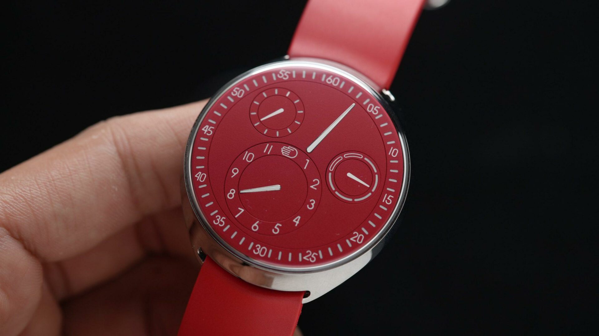 Ressence Type 1 Slim Red being held and displayed in hand.