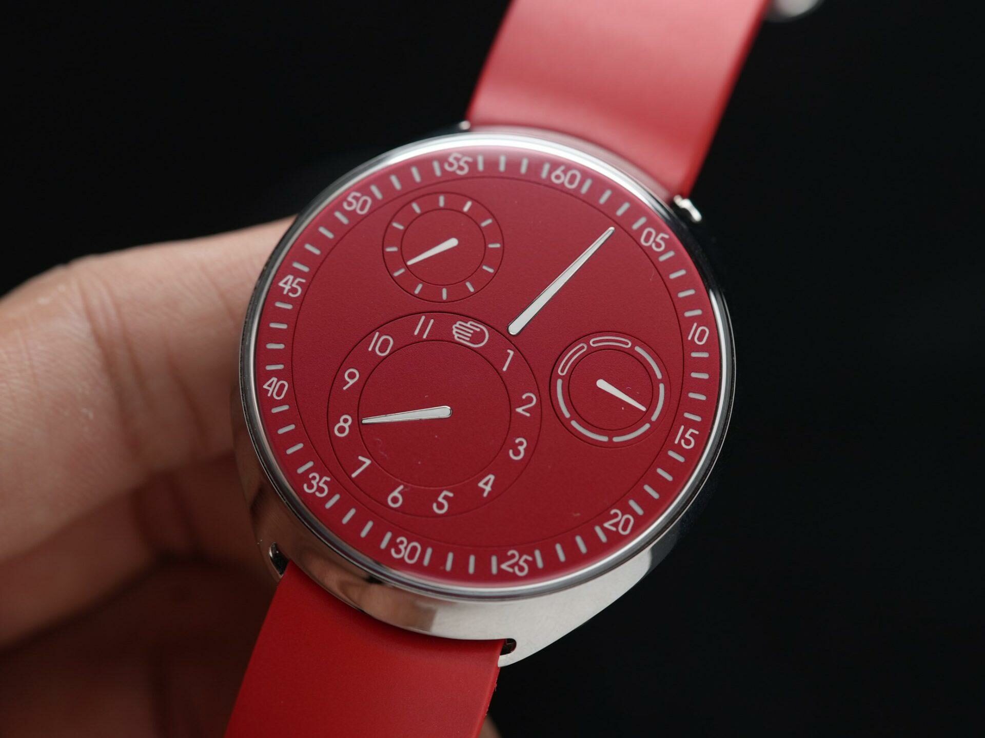 Ressence Type 1 Slim Red being held and displayed in hand.