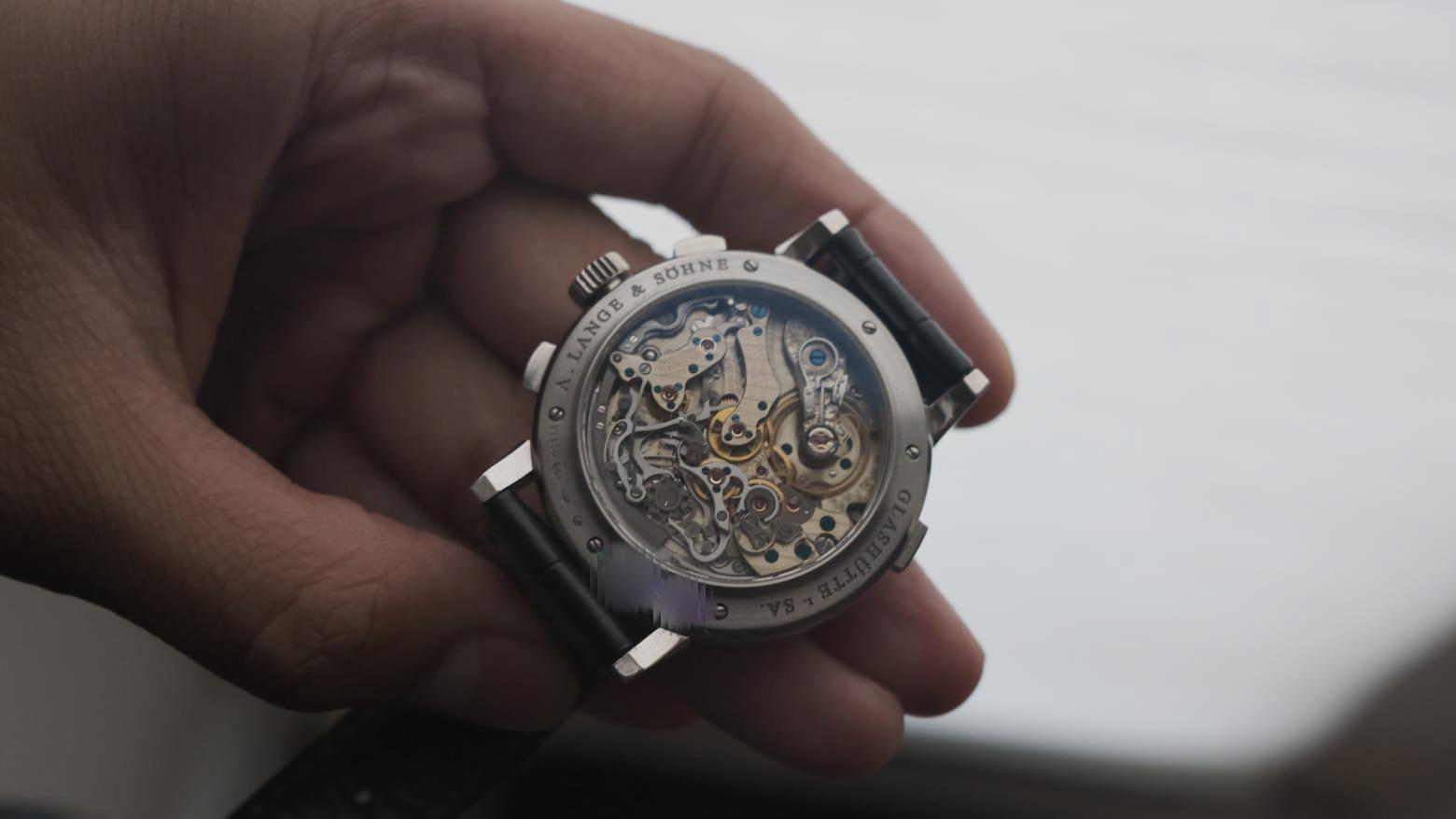 The back side of the A. Lange & Söhne Datograph Platinum 405.035 displayed in hand under natural white light.