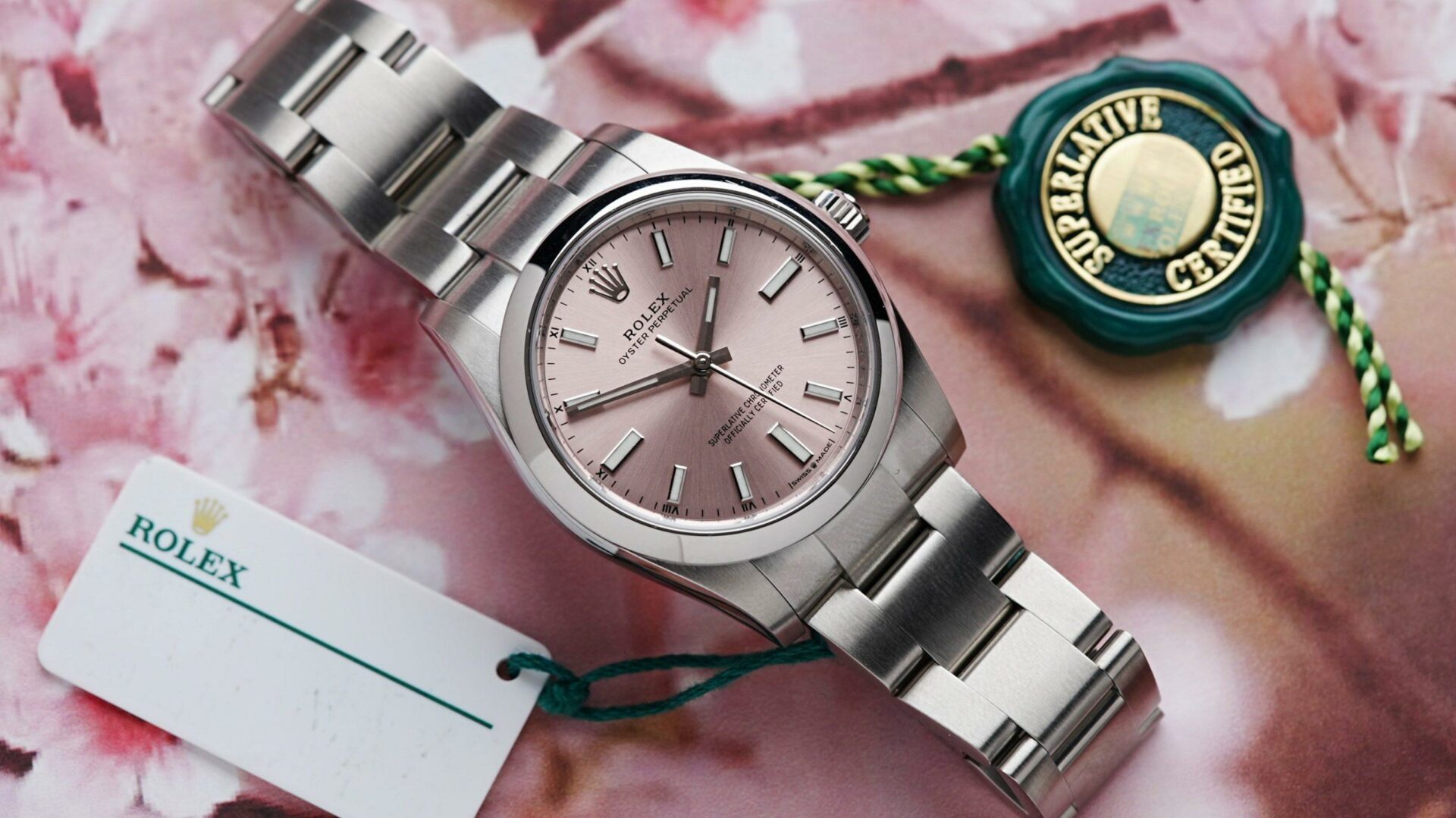 Rolex Oyster Perpetual 34 Pink Dial 2022 featured on pink flowers.