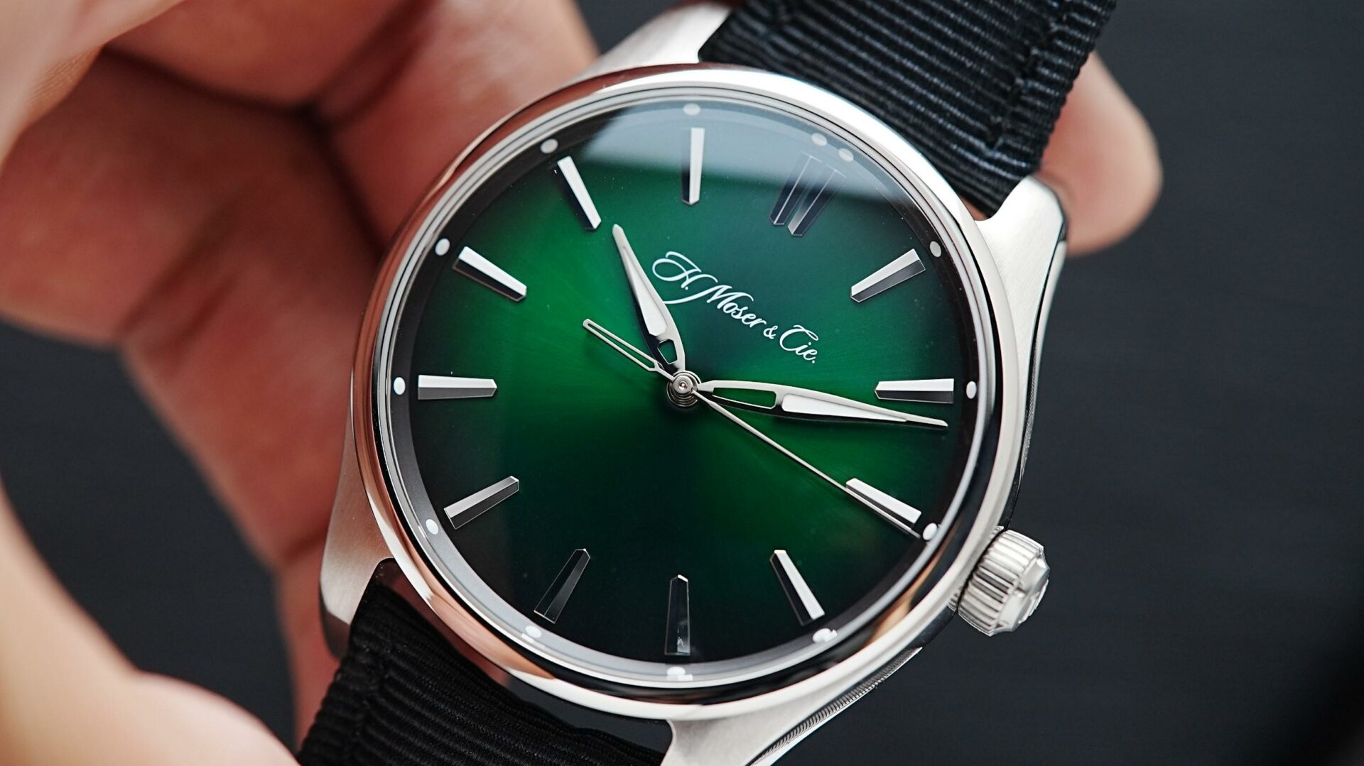 H.Moser & Cie. Pioneer Centre Seconds Cosmic Green held in hand.