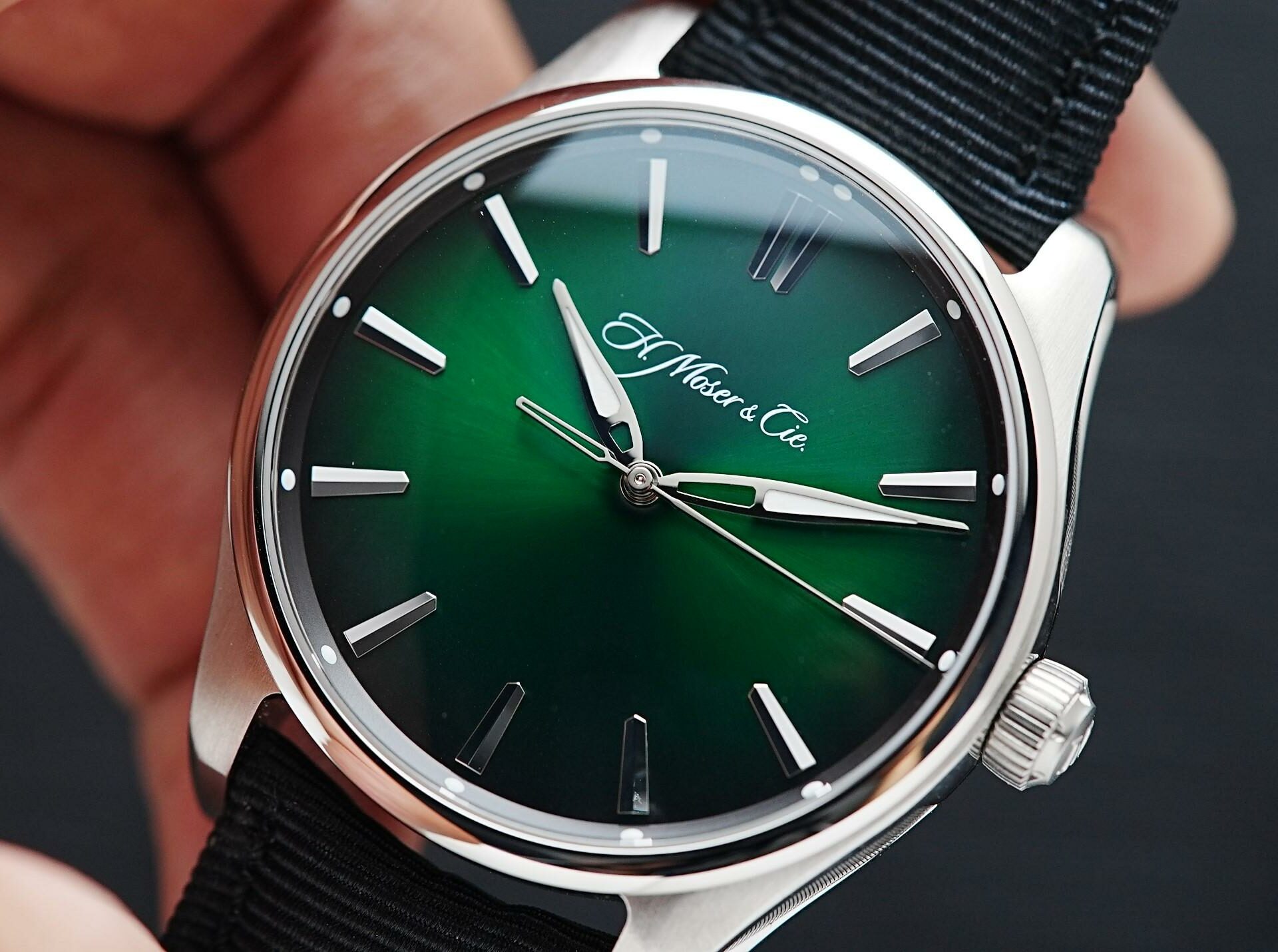 H.Moser & Cie. Pioneer Centre Seconds Cosmic Green held in hand.