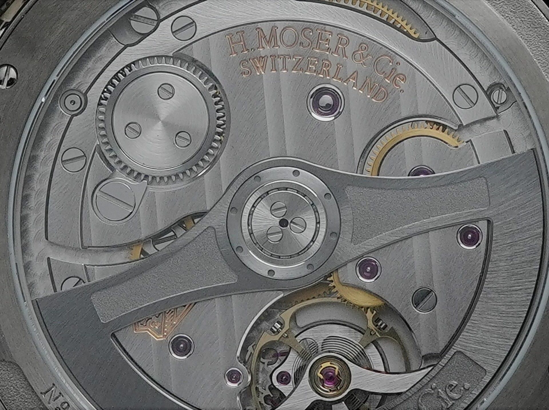 Back side of the H.Moser & Cie. Pioneer Centre Seconds Cosmic Green.
