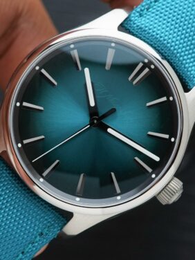 H.Moser & Cie. Pioneer Centre Seconds Mega Cool Blue Lagoon held in hand.