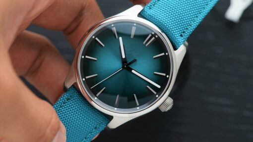 H.Moser & Cie. Pioneer Centre Seconds Mega Cool Blue Lagoon held in hand.