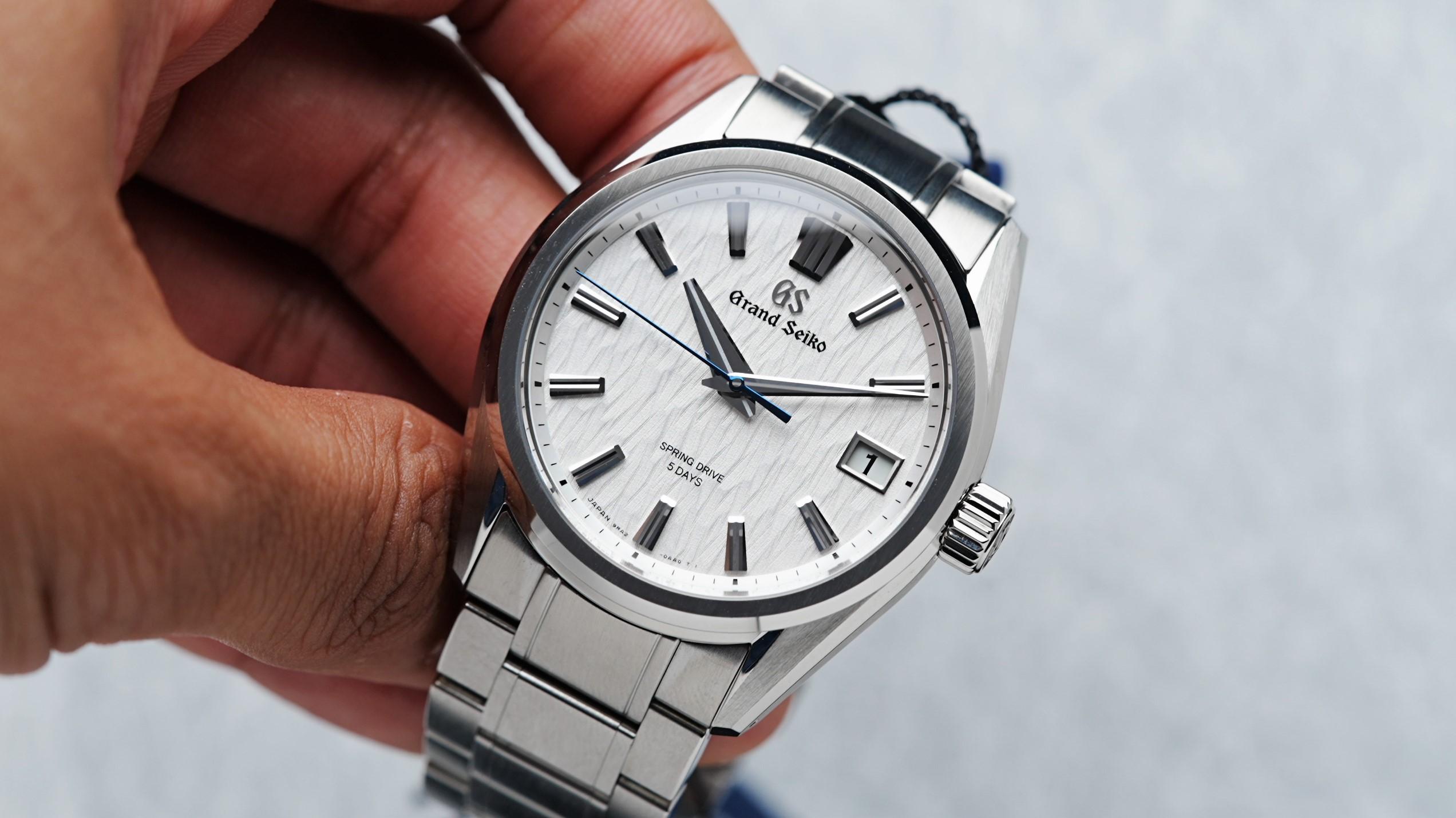 Grand Seiko Spring Drive 9ra2 White Birch being held in hand.