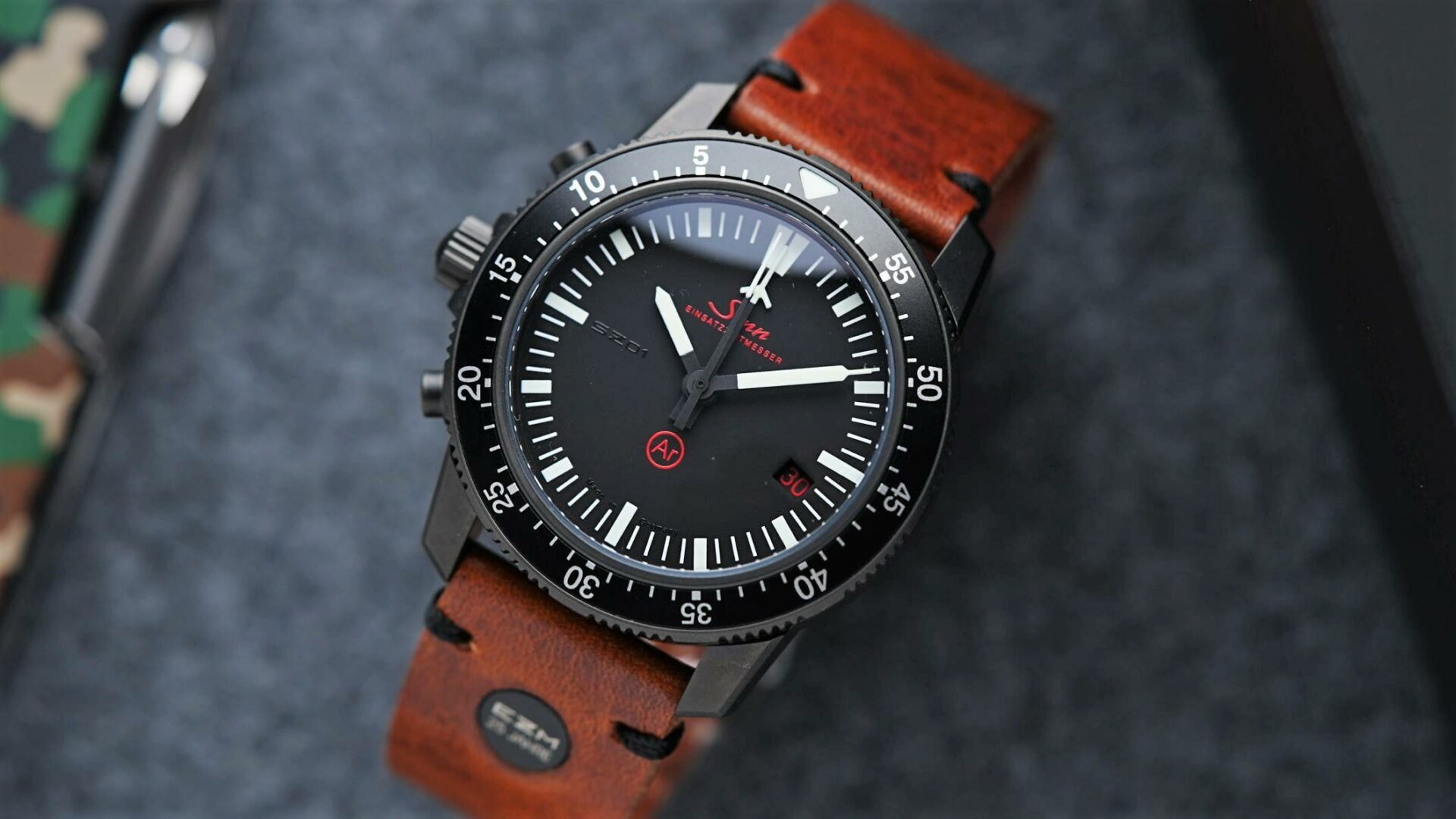 Sinn EZM 1.1S Limited Edition 500 with army knife in background.