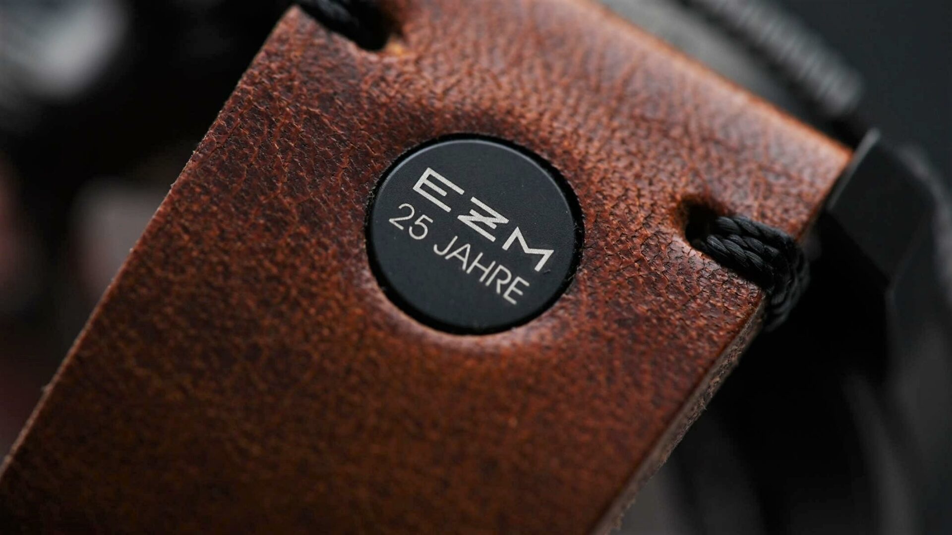 Sinn EZM 1.1S Limited Edition 500 closeup shot of 25th anniverssary button on strap "EZM 25 JAHRE".