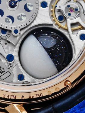 Back side of the Arnold & Son Luna Magna 28 Pieces Limited Edition 3D Moon watch movement and moon.
