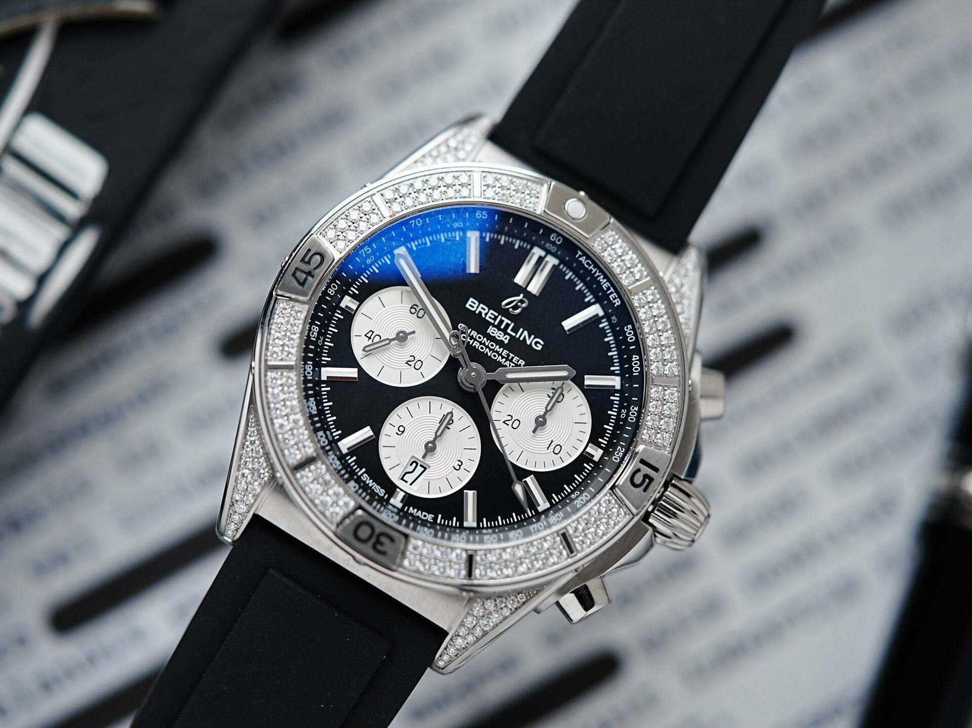 Diamond embezzled Breitling B01 42 Chronomat watch pictured on an angle under white light.