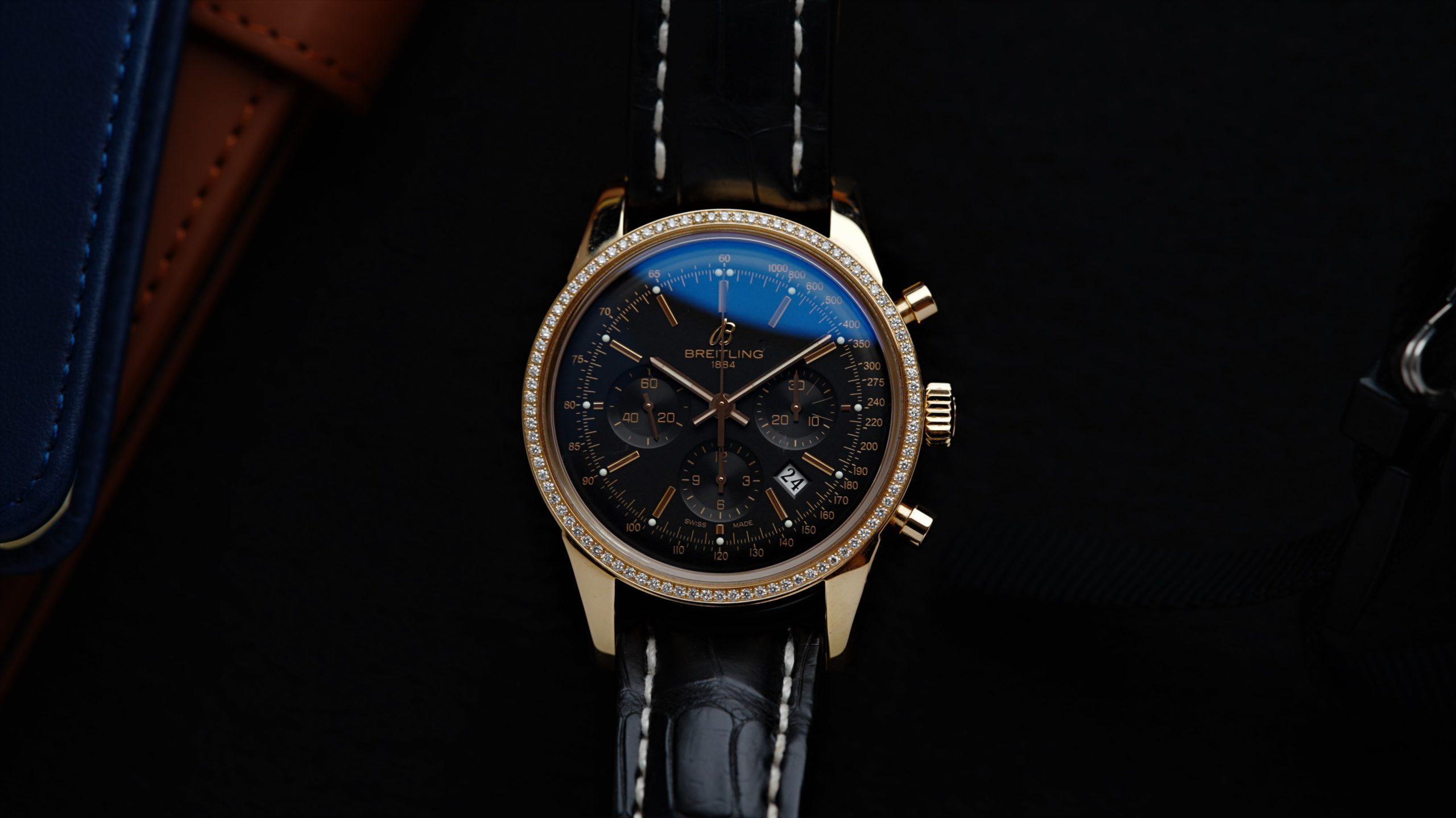 Breitling Transocean Chronograph Diamonds Rose Gold watch featured under white lighting.