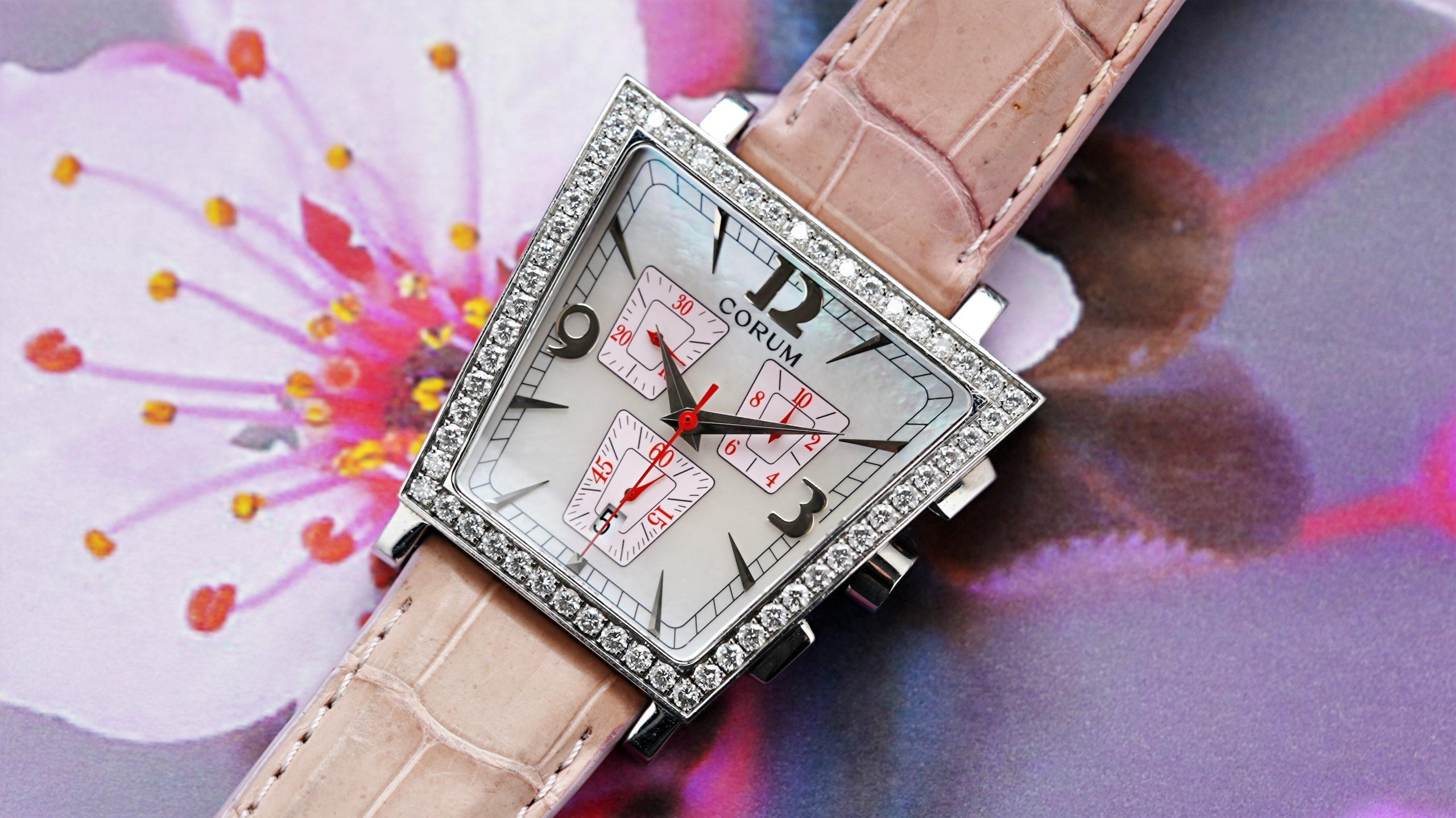 Corum Trapeze Diamomd Chronograph featured behind flowers.