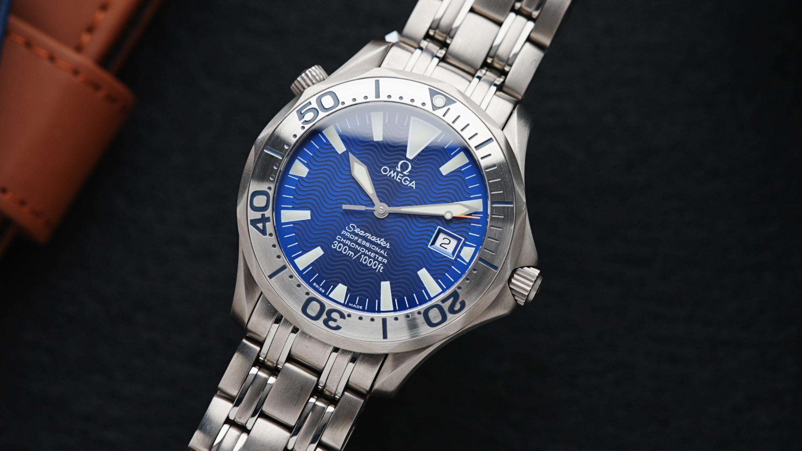 Omega Seamaster Professional 300m Electric Blue with Sword Hands angle shot under white lighting.