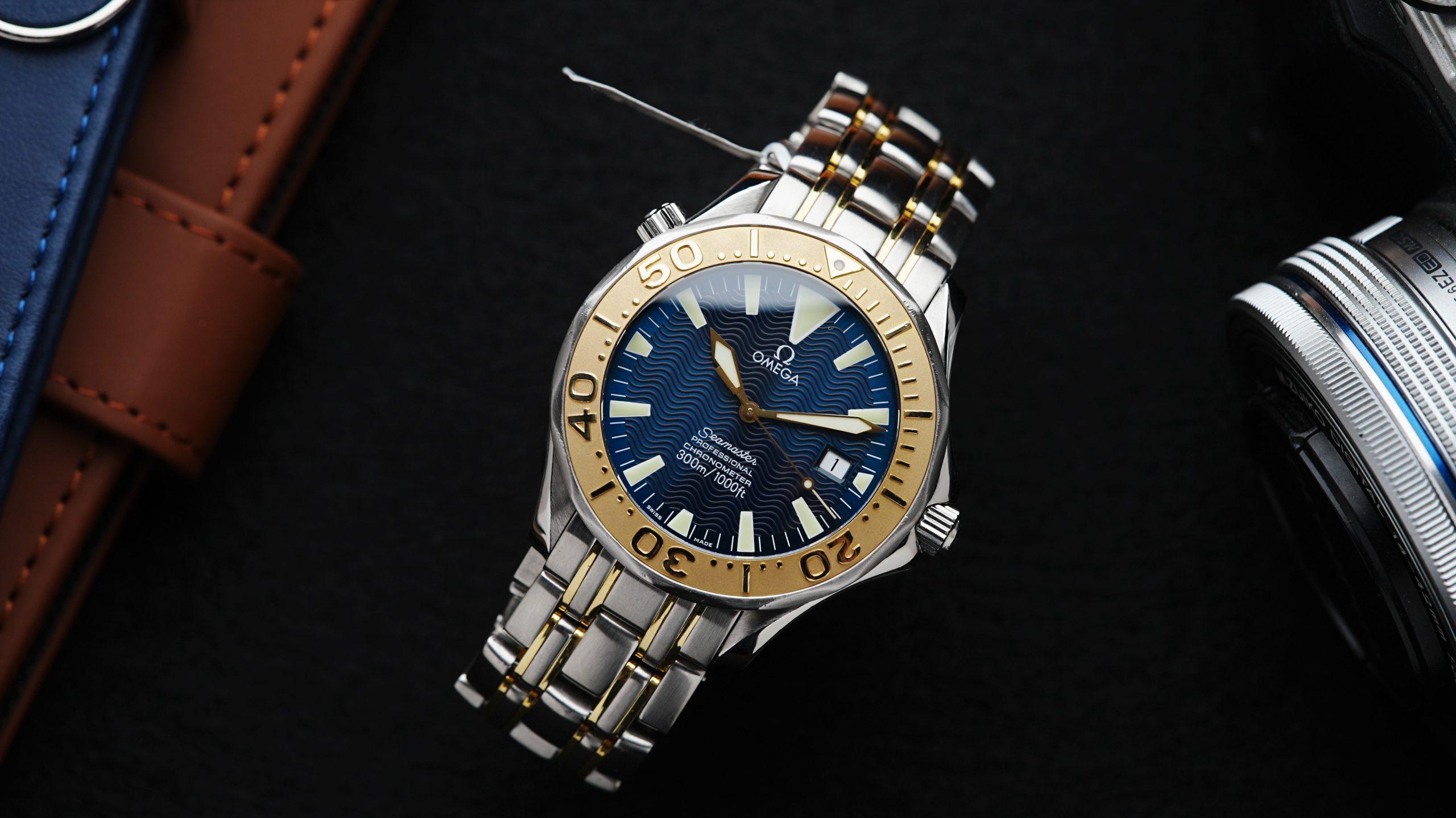 Omega Seamaster Sword Hands Gold & Steel Blue Dial Rare pictured on an angle under white light.
