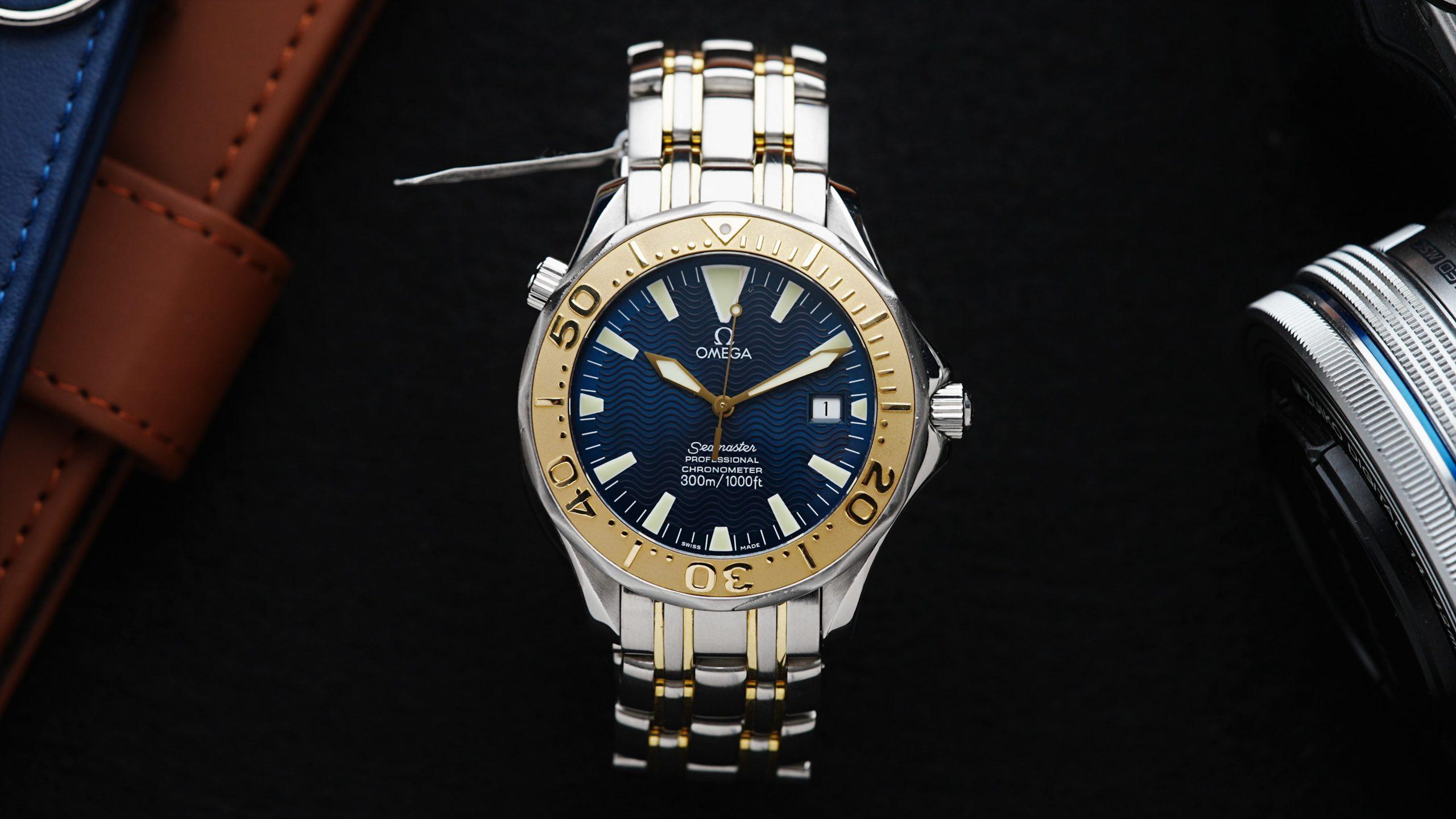 Omega Seamaster Sword Hands Gold & Steel Blue Dial Rare featured under white lighting.