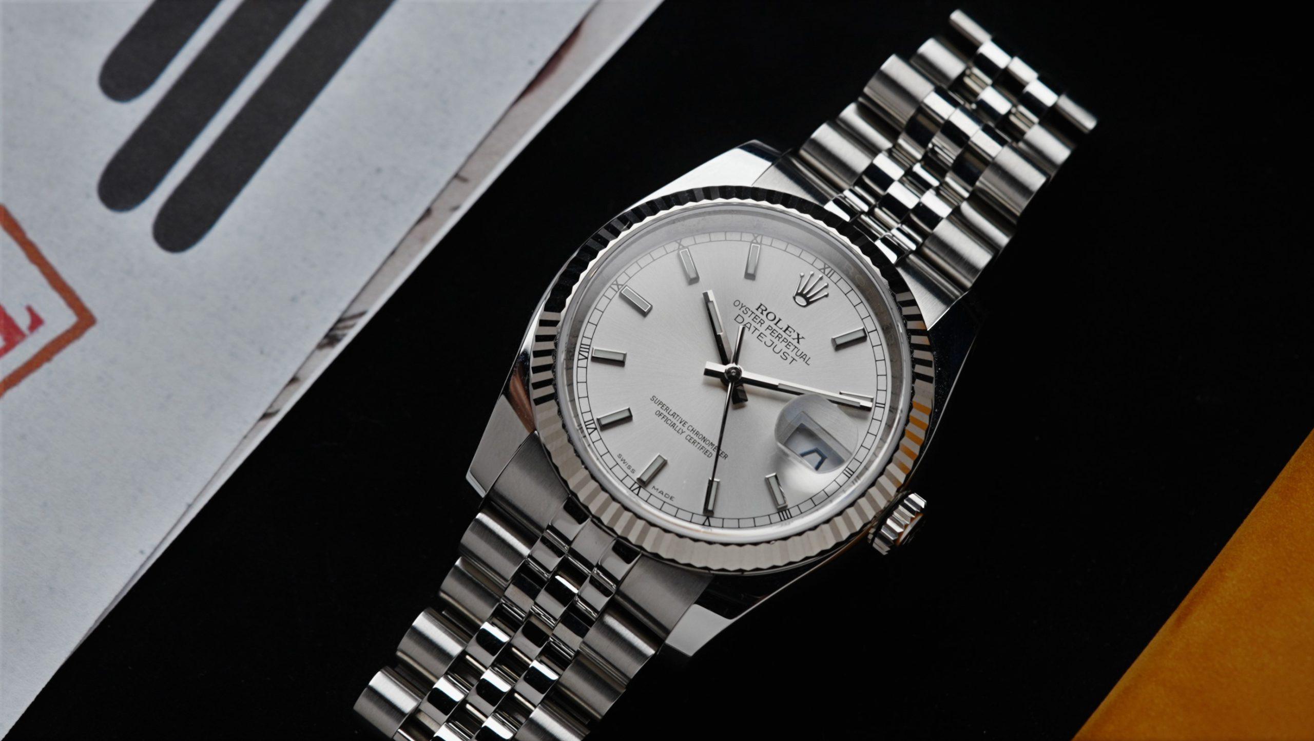 Rolex Datejust 36 Silver Dial watch pictured on an angle under white lighting.