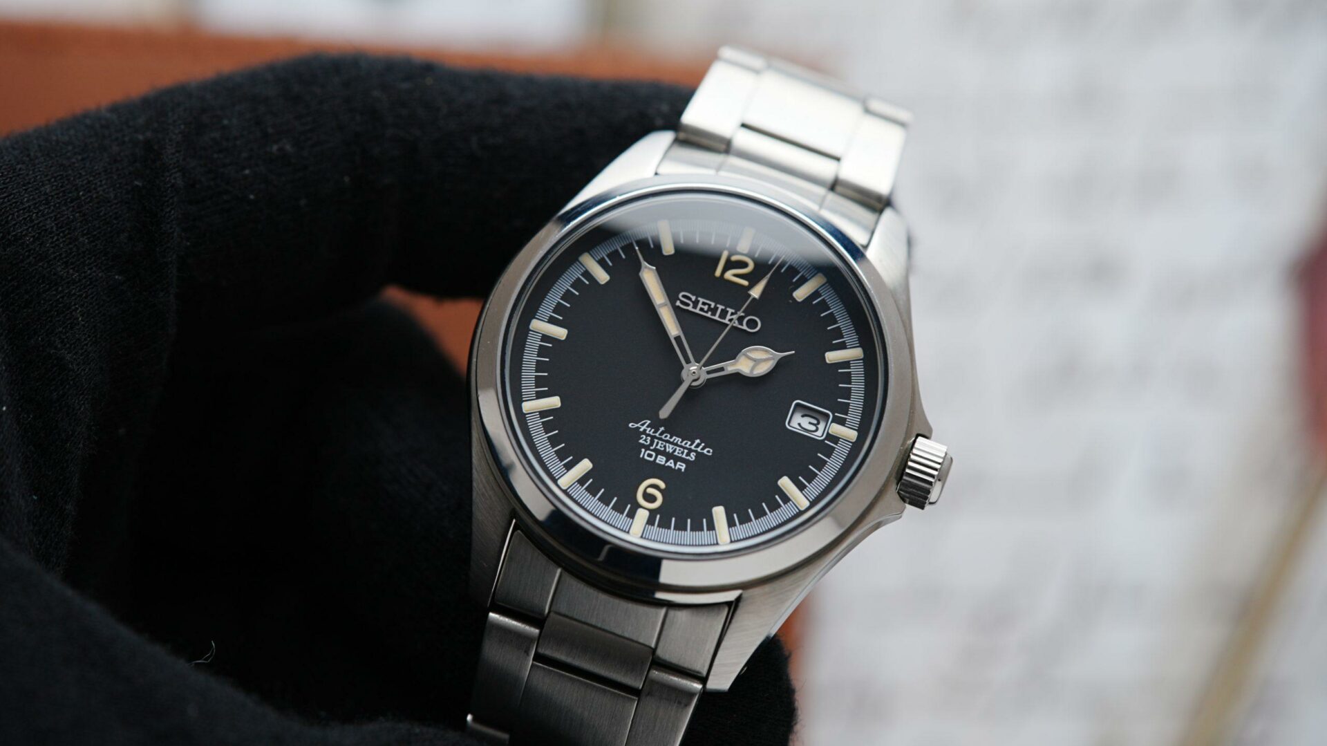 Seiko Explorer 1016 Limited Edition being held with black glove.