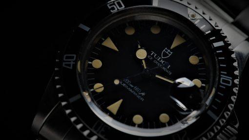 Tudor Submariner Lollipop Hands Perfect Patina 76100 watch zoomed in up close on dial.