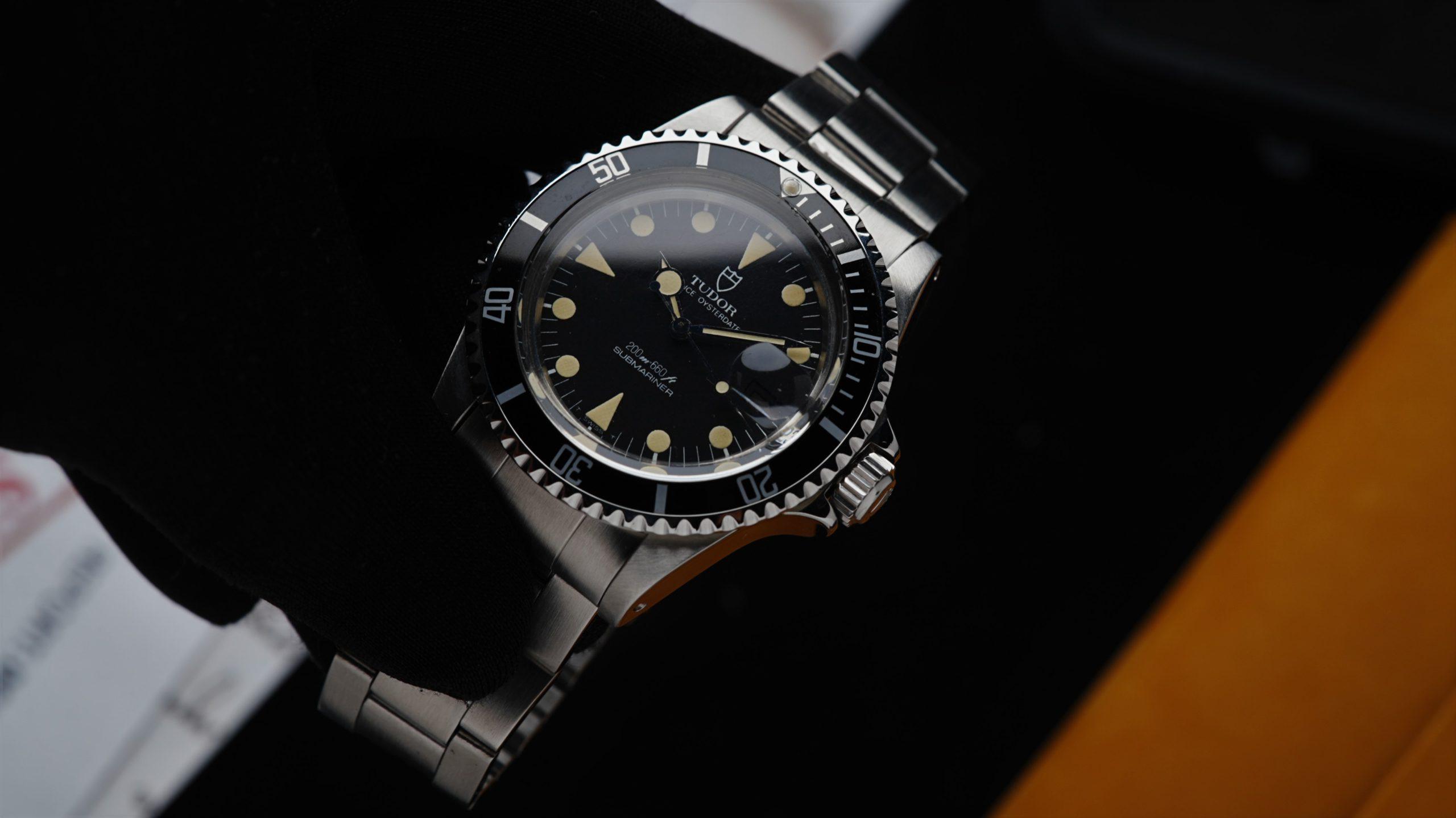 Tudor Submariner Lollipop Hands Perfect Patina 76100 watch being held in hand.