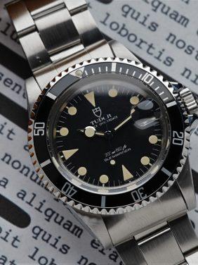 Tudor Submariner Lollipop Hands Perfect Patina 76100 watch showcased under white lighting.