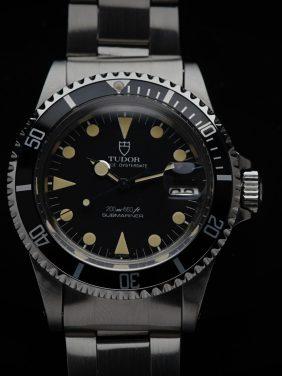 Tudor Submariner Lollipop Hands Perfect Patina 76100 watch featured under white lighting.
