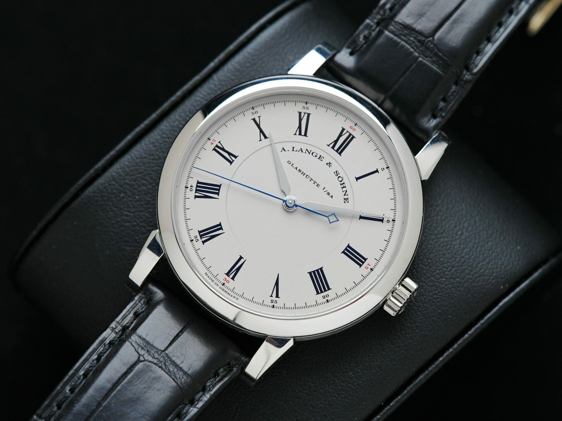 A. Lange & Söhne Richard Lange Platinum watch featured on watch pillow.