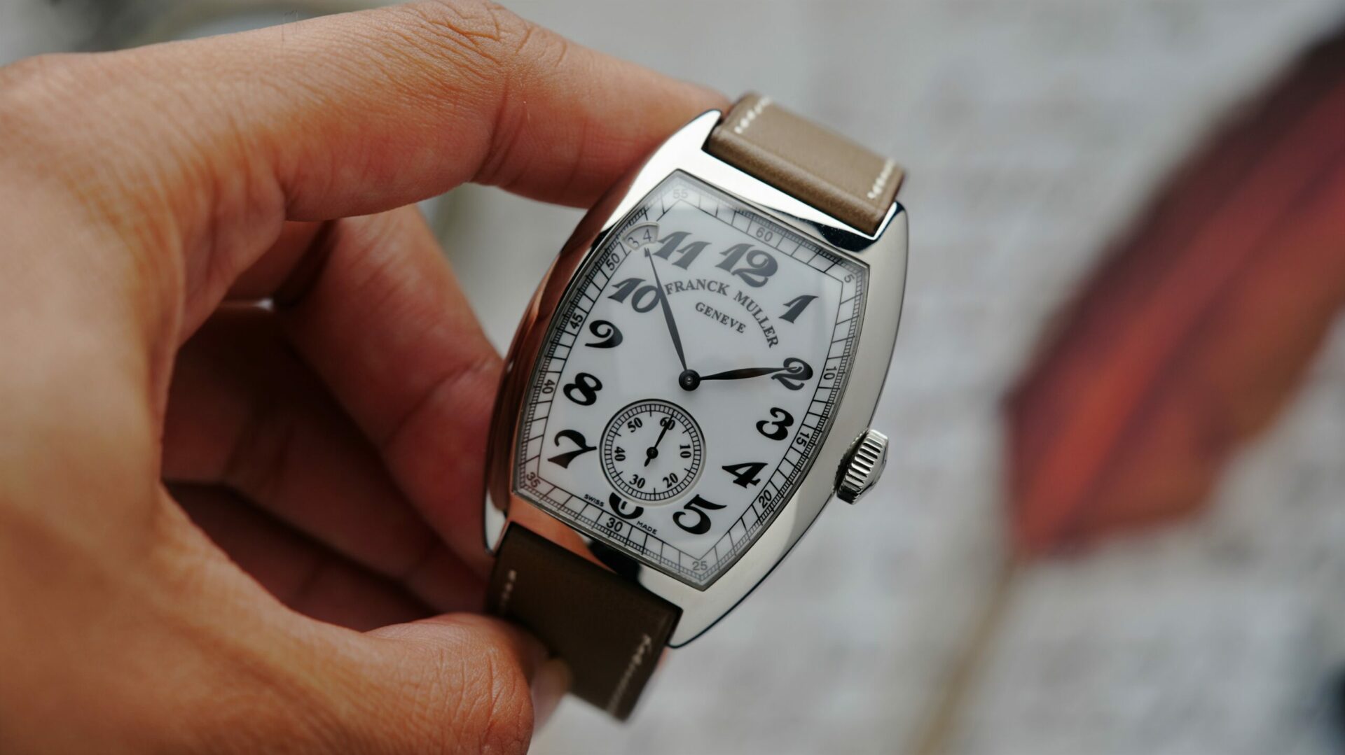 Franck Muller Vintage Curvex 7 Day Reserve watch being held in hand.