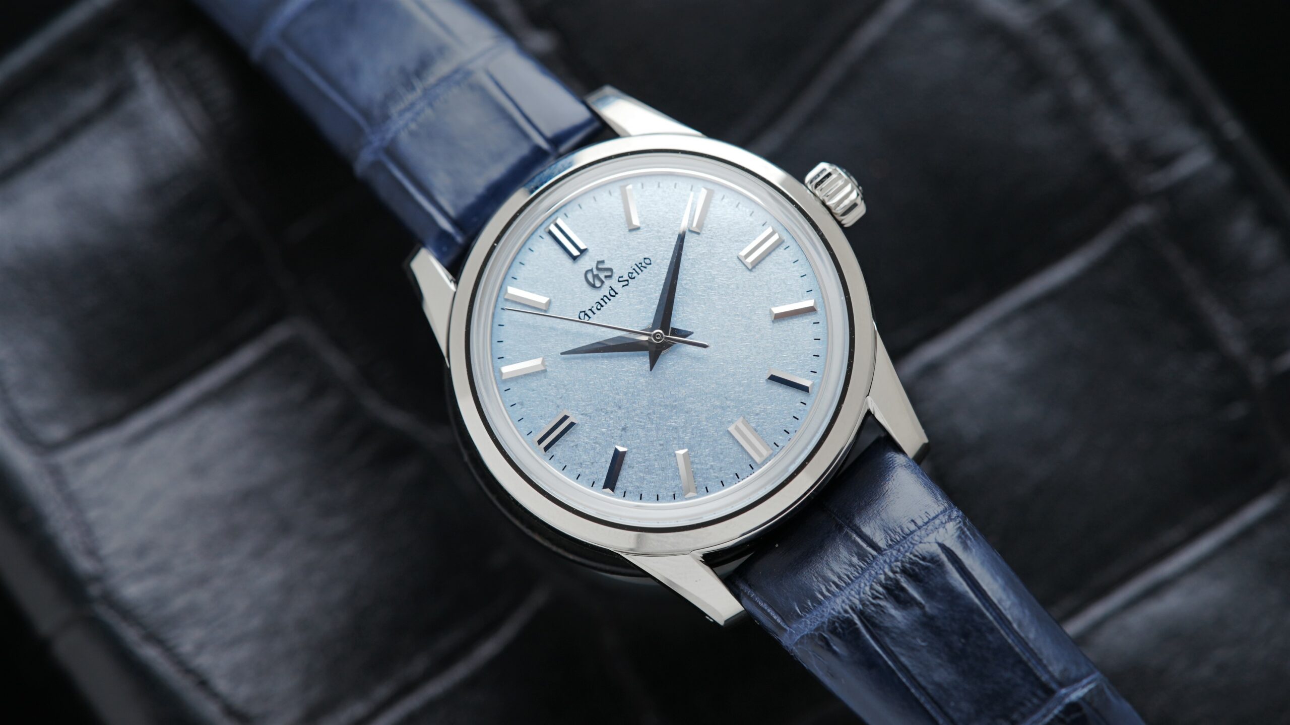 Elegant Grand Seiko watch with Ice Blue Dial angle shot under white light.