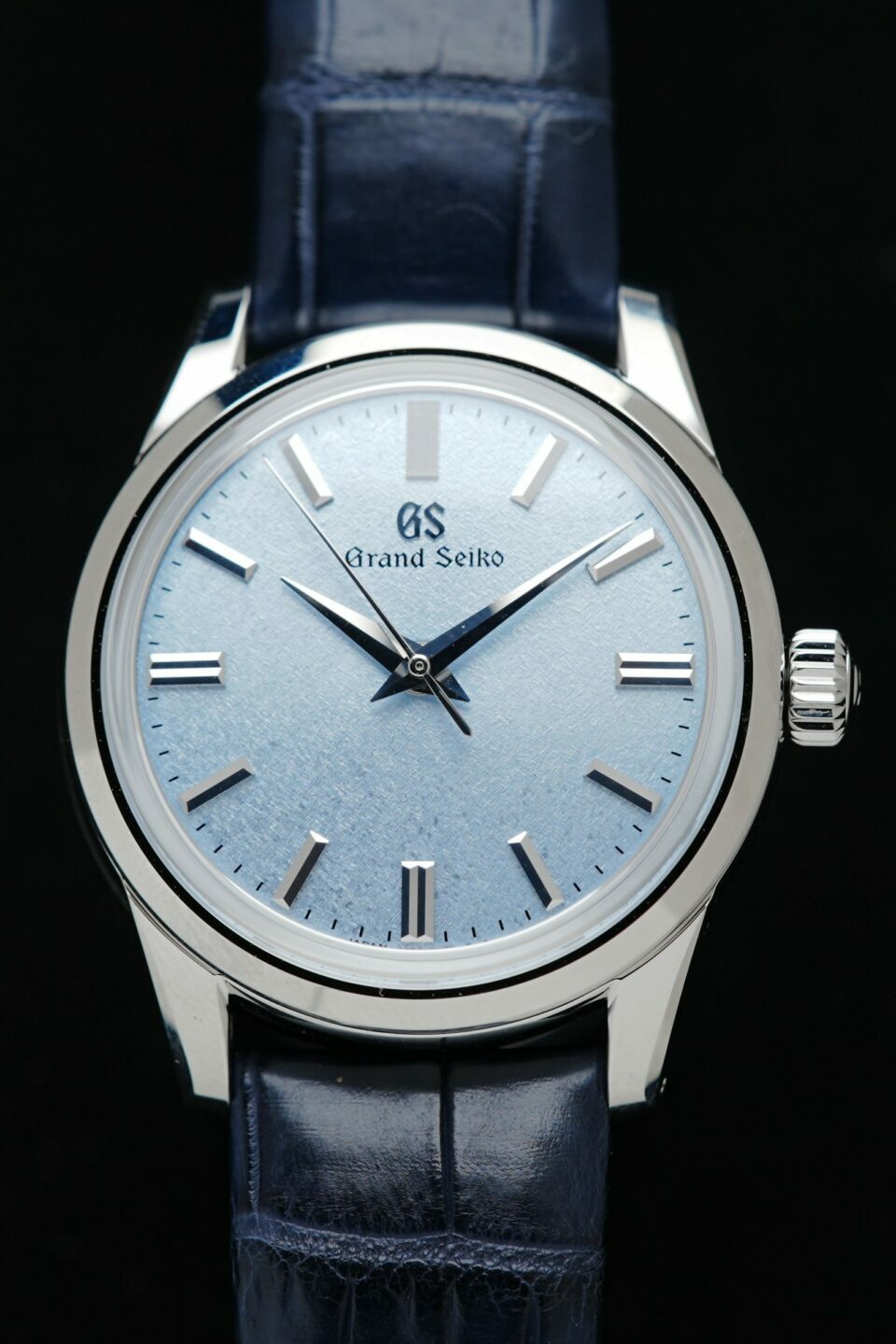 Elegant Grand Seiko watch with Ice Blue Dial featured under white lighting.