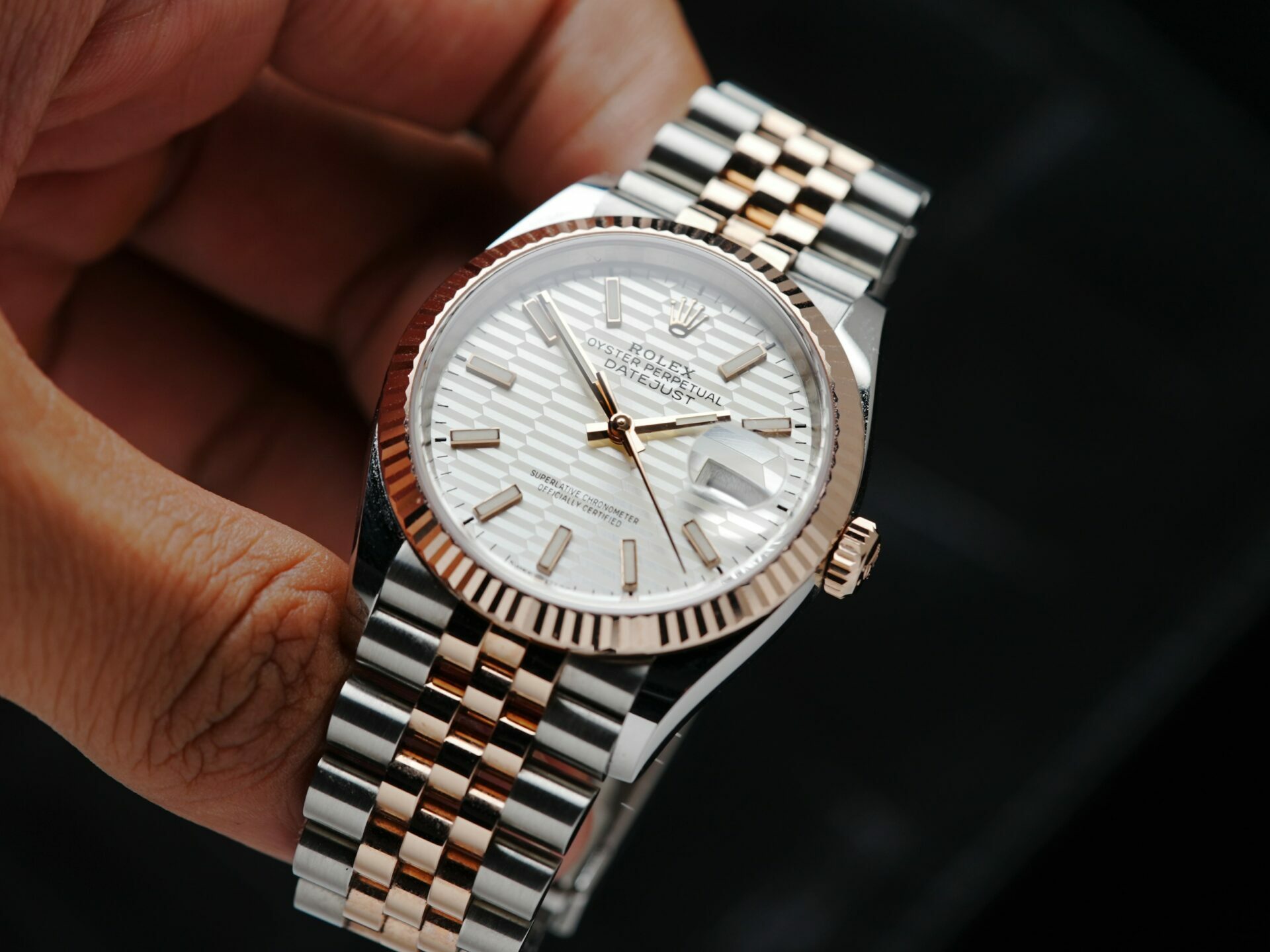 Rolex Datejust 36 Motif Rose Gold 2022 watch being held in hand.