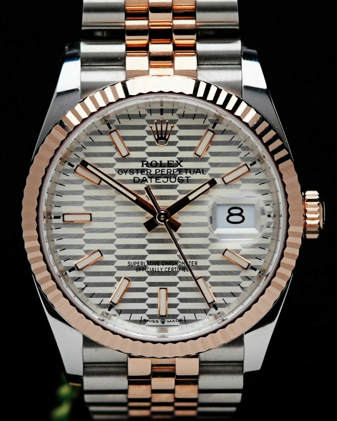 Rolex Datejust 36 Motif Rose Gold 2022 watch featured under white lighting.