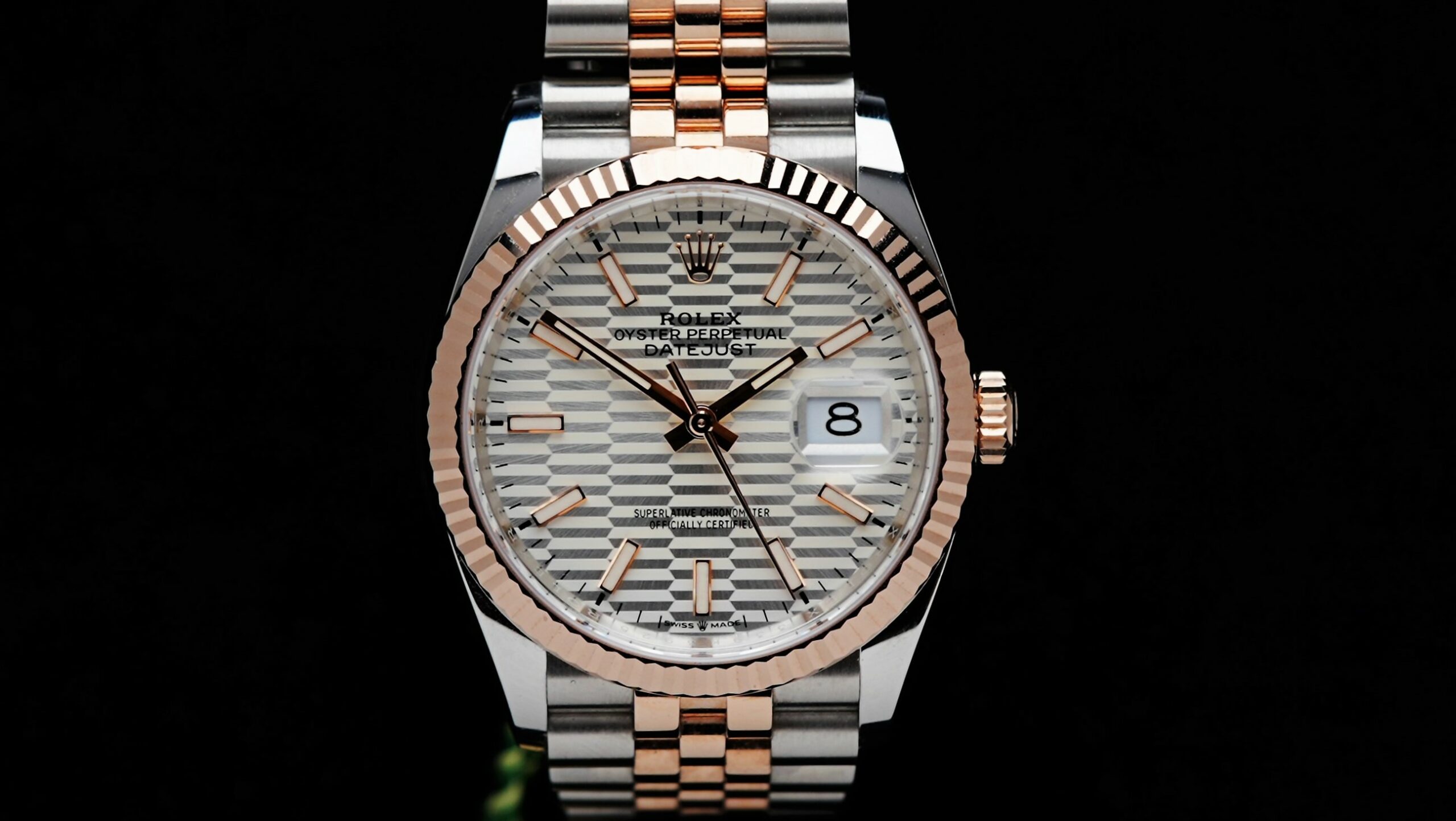 Rolex Datejust 36 Motif Rose Gold 2022 watch featured under white lighting.