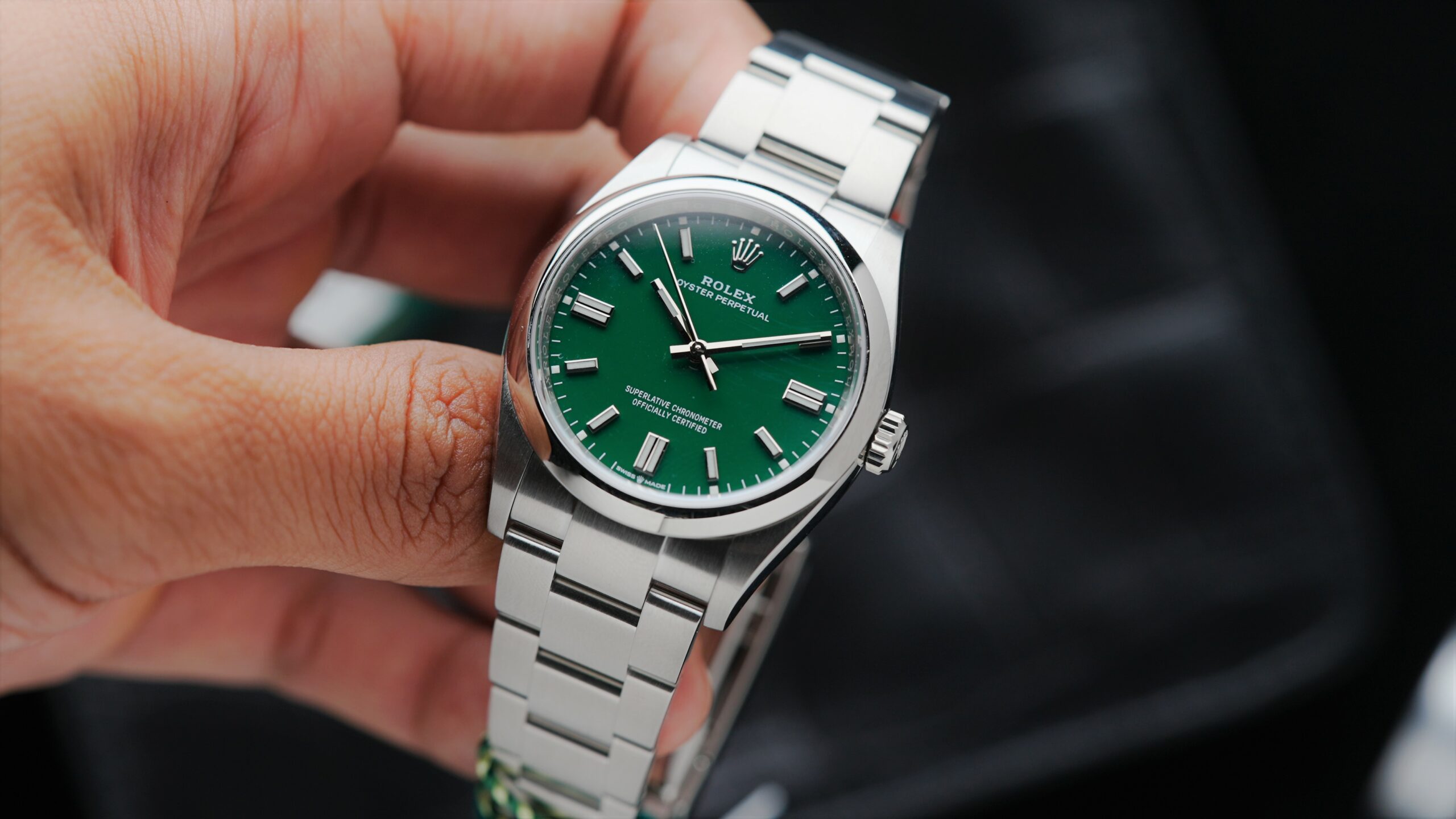 Rolex Oyster Perpetual 36 Green 2022 watch being held in hand.