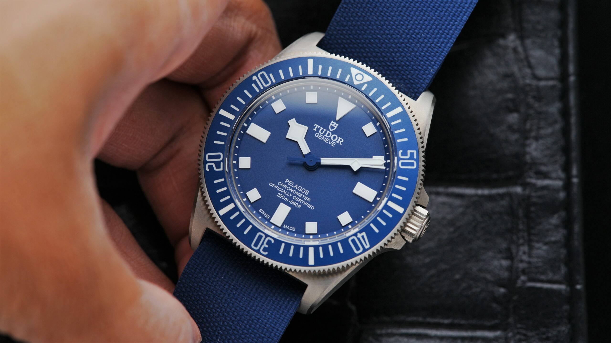 Tudor Pelagos Fxd 42 Marine Nationale watch being held in hand.