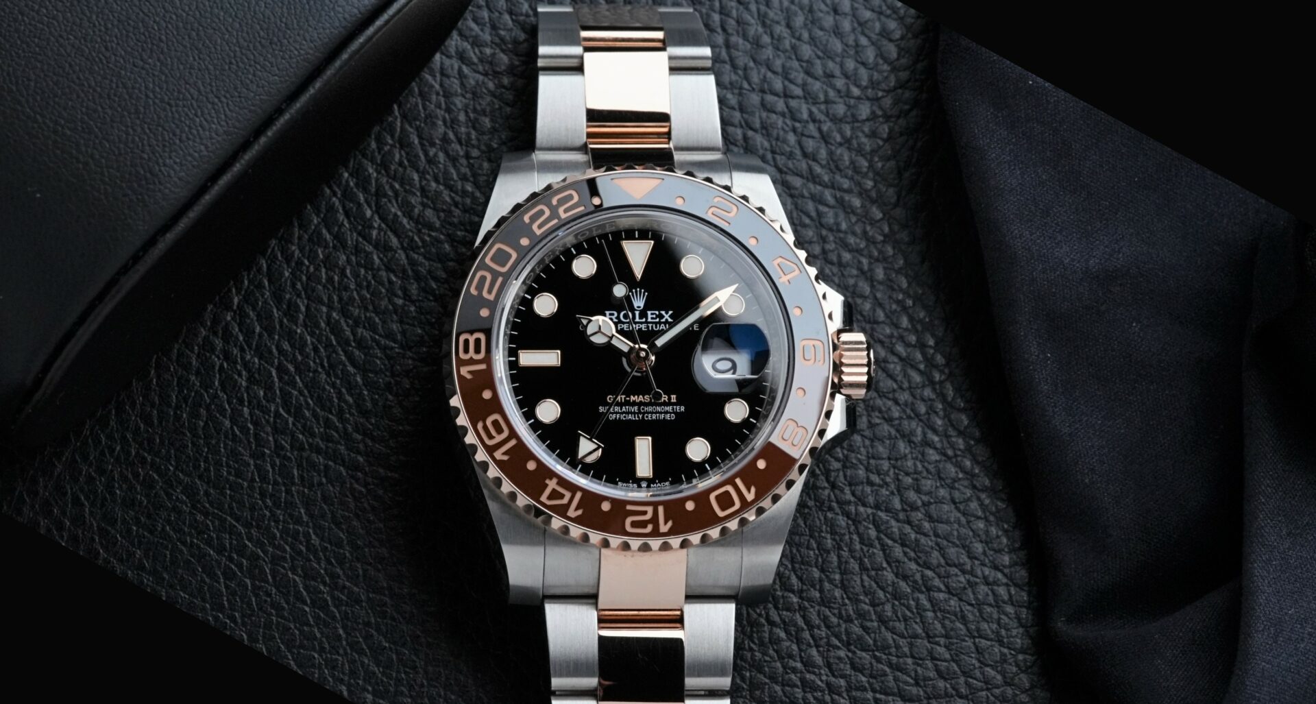 Rolex GMT-Master II Rootbeer Ceramic watch on display up close.