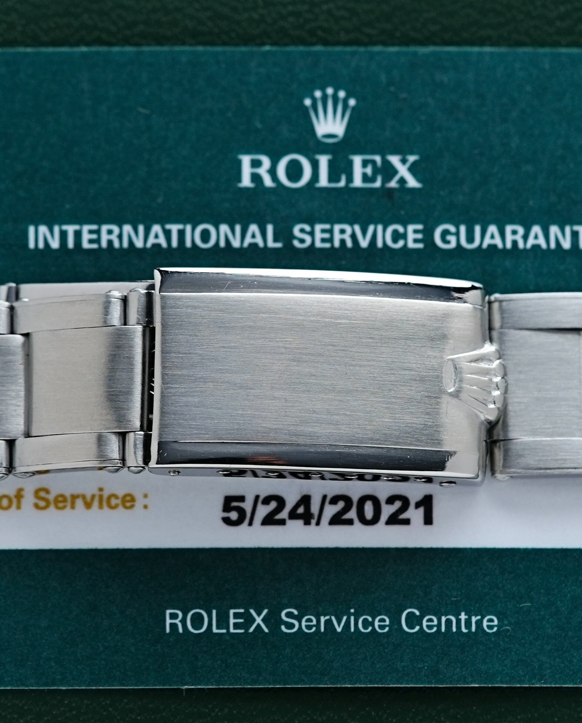 Image showing date of service for the Rolex Submariner 5513 Bart Simpson Tropical Dial Original Patina Unpolished watch.