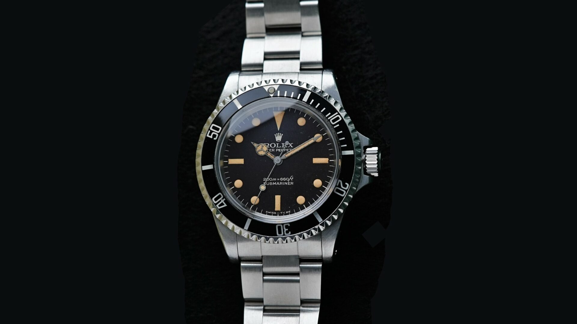 Rolex Submariner 5513 Bart Simpson Tropical Dial Original Patina Unpolished watch featured under white light.