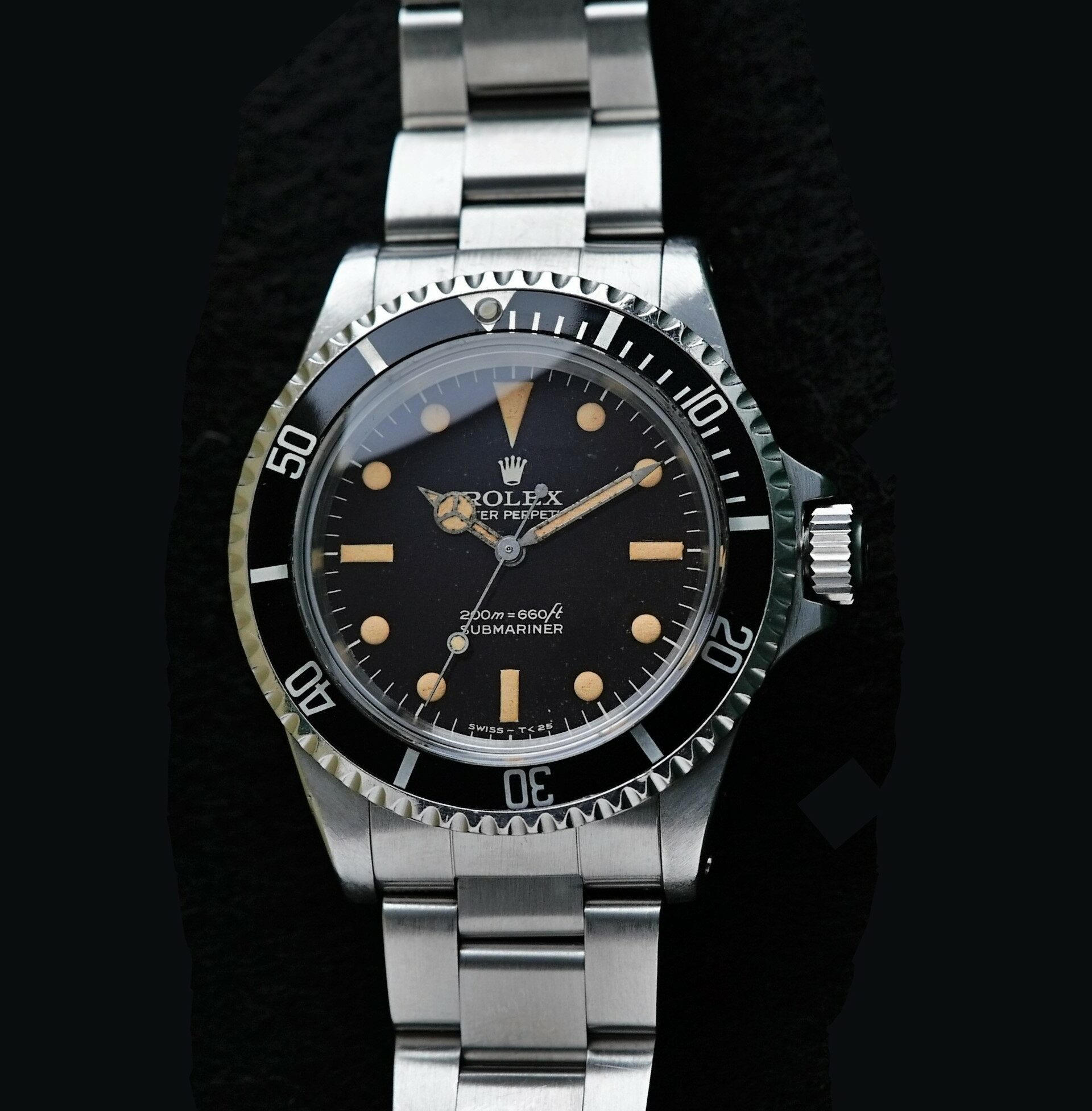 Rolex Submariner 5513 Bart Simpson Tropical Dial Original Patina Unpolished watch featured under white light.