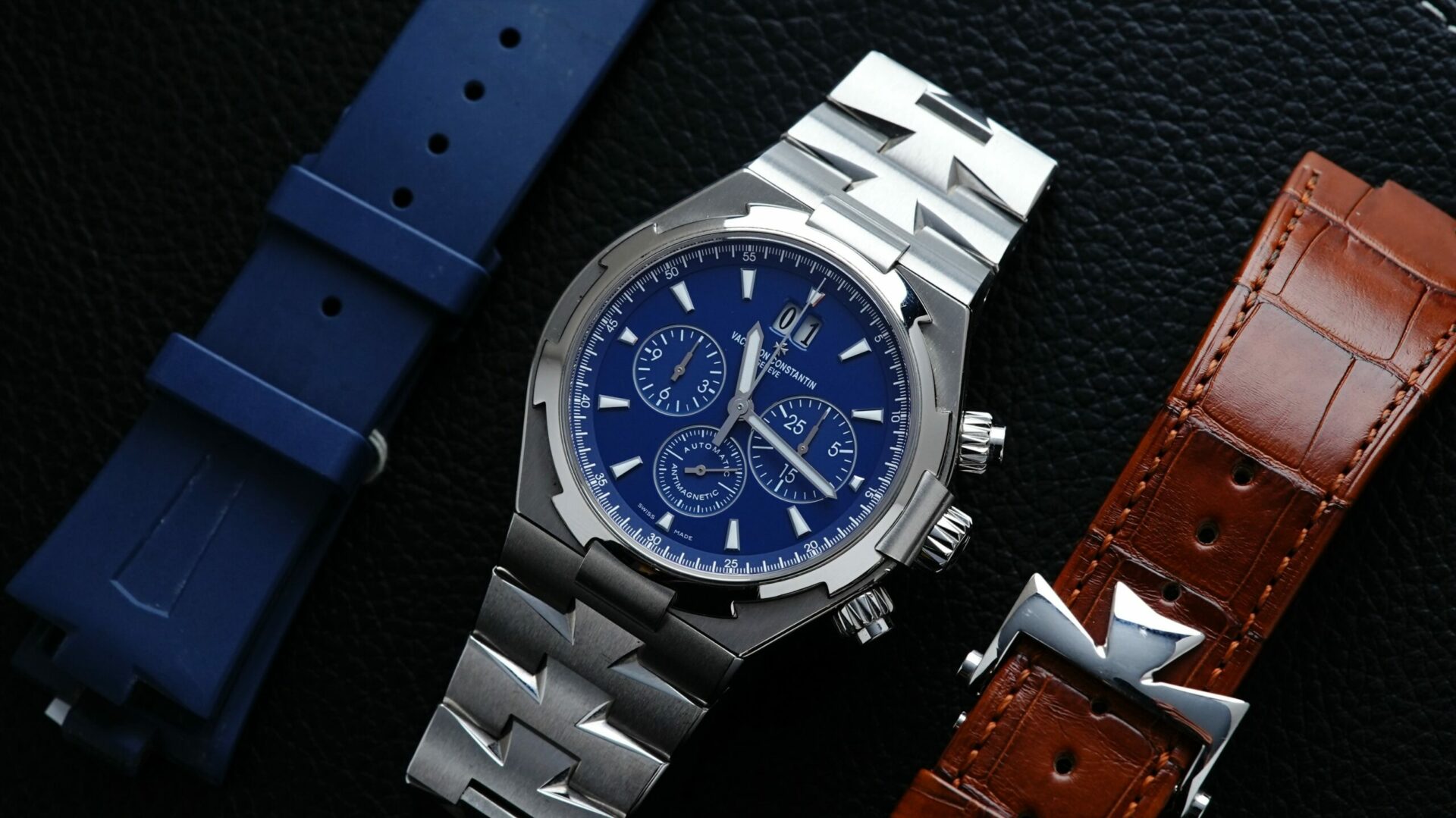 Vacheron Constantin Overseas Chronograph Very Rare 2nd Gen Blue Dial alongside rubber and leather straps.
