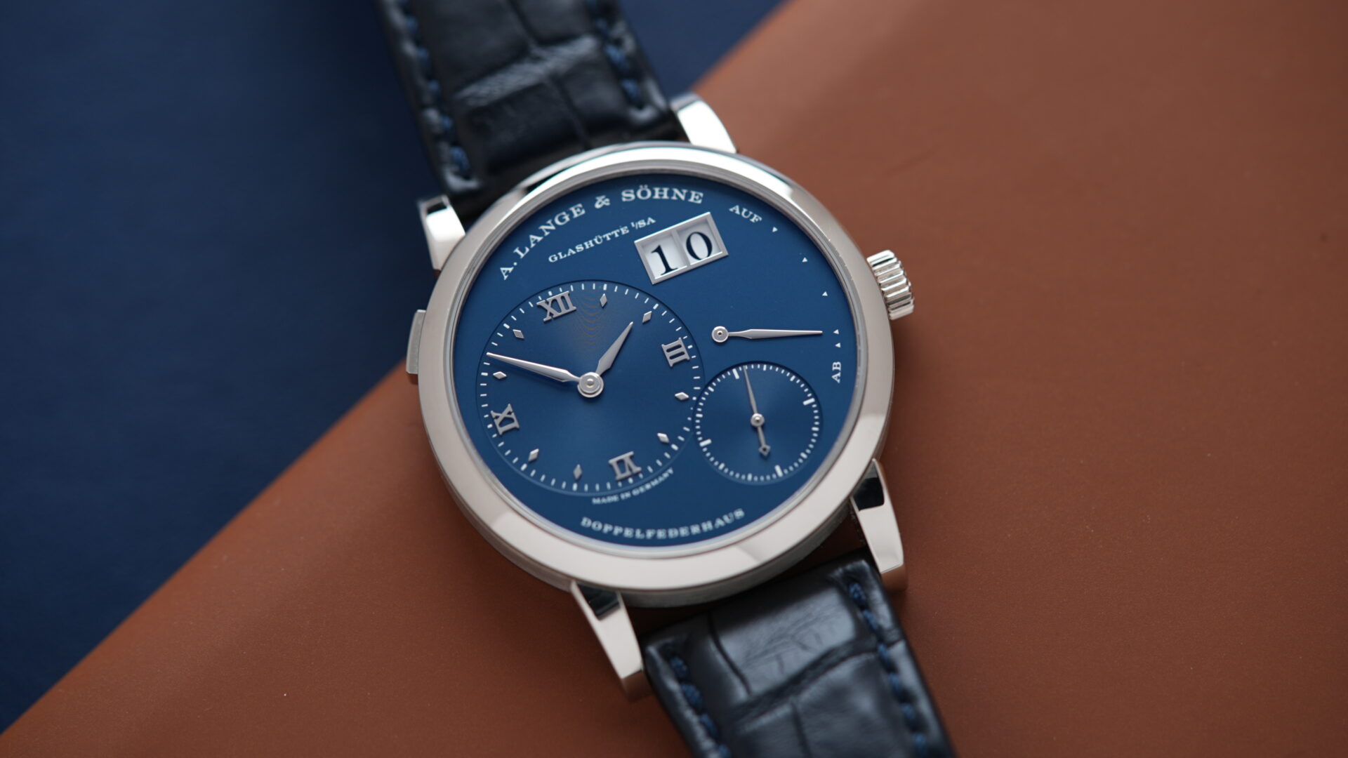 A. Lange & Söhne Lange 1 'Blue Series' 191.028 White Gold watch displayed on an angle underneith white light.