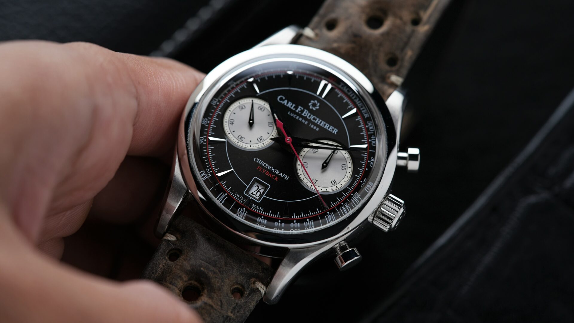 Carl F. Bucherer Manero Flyback Chronograph 00.10919.08.33.02 watch held in hand.