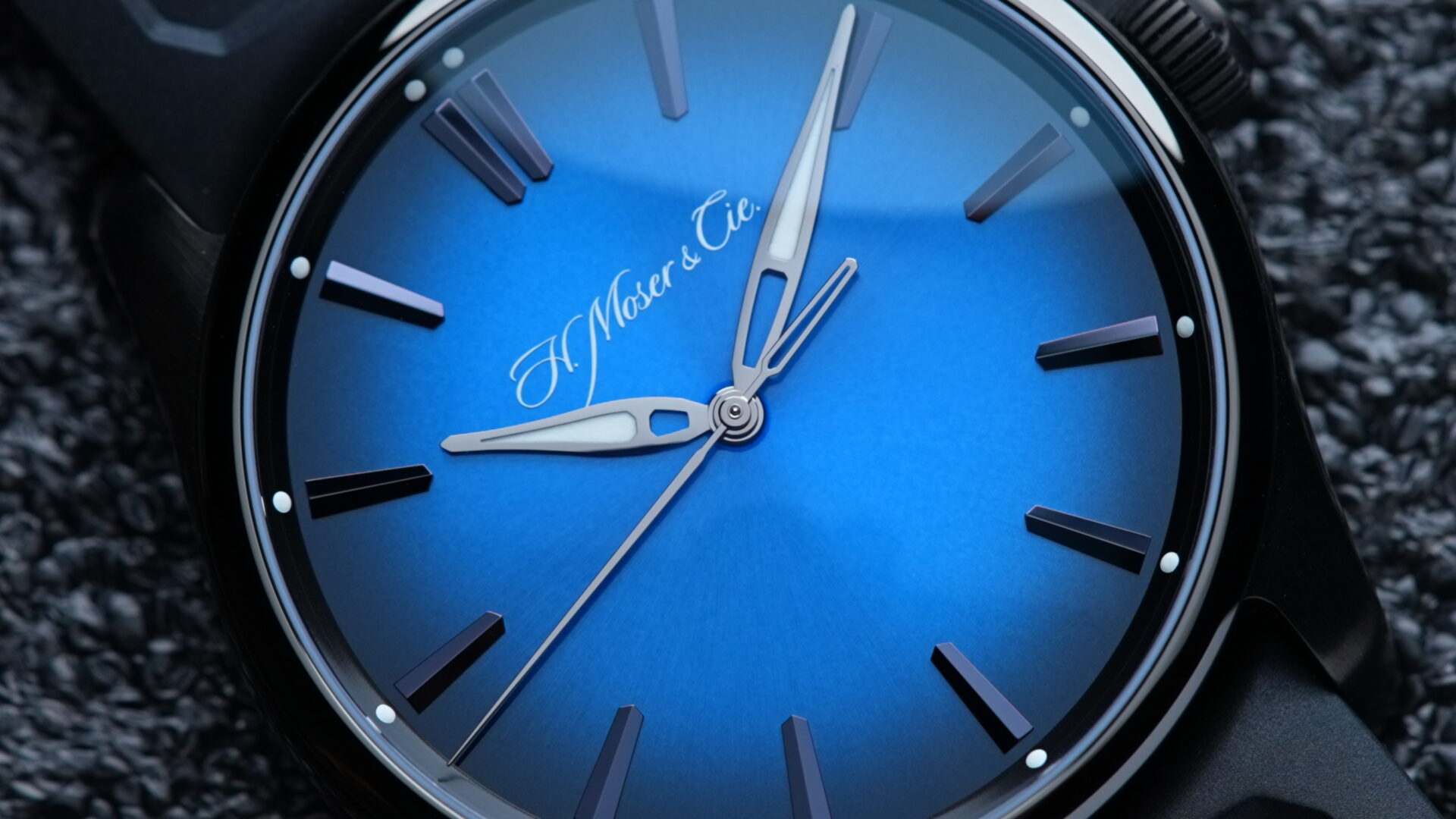 Close up shot of the dial on the H.Moser & Cie. Pioneer Centre Seconds Funky Blue Fumé Black watch.