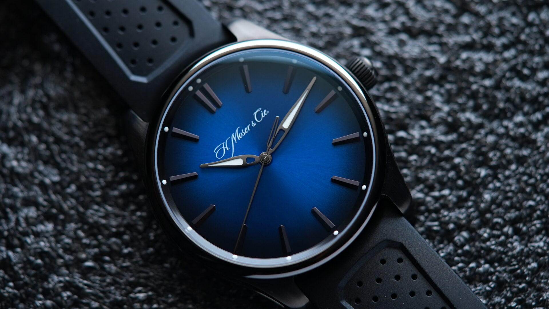 H.Moser & Cie. Pioneer Centre Seconds Funky Blue Fumé Black watch featured on an angle under white light.