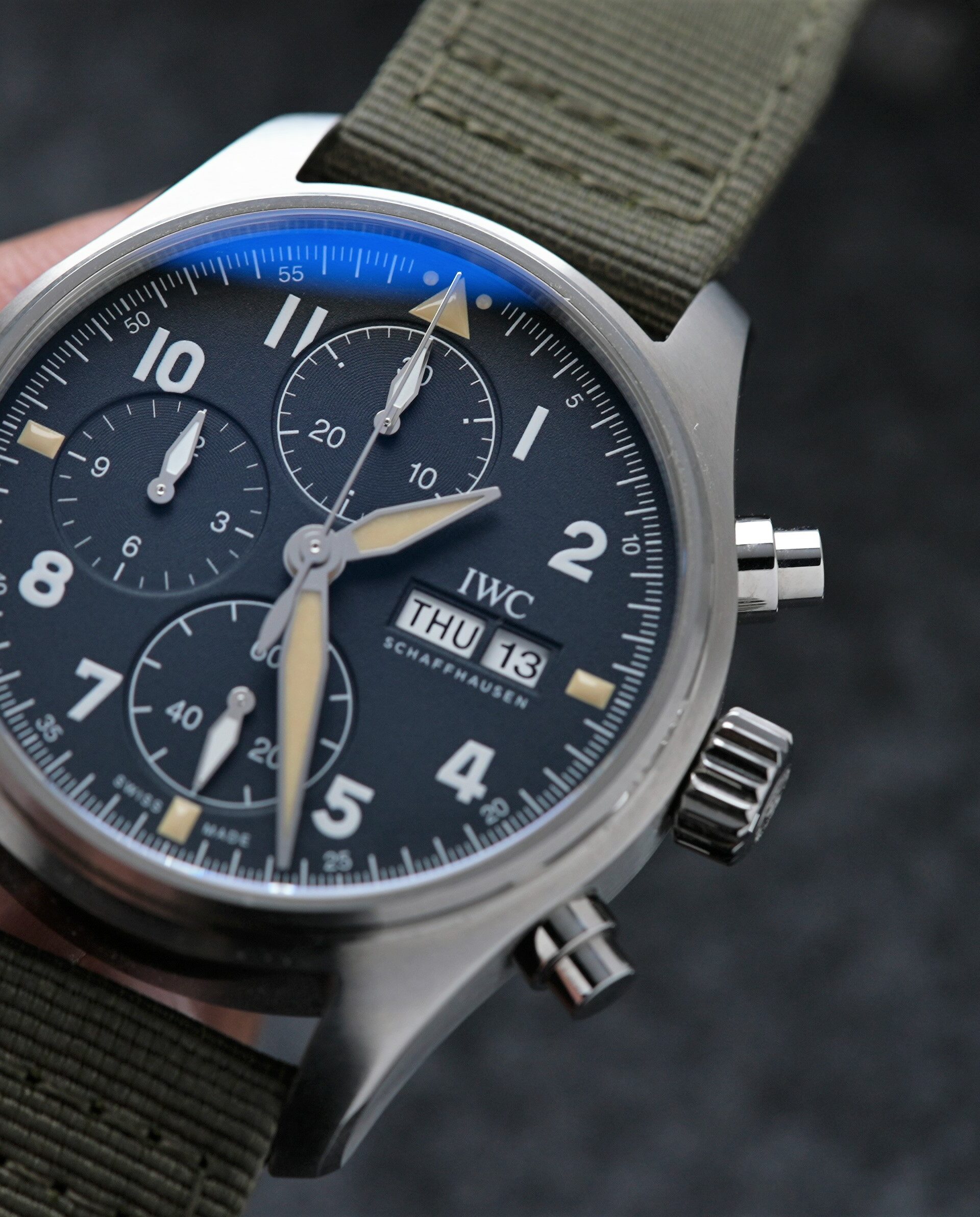 IWC Pilot Spitfire Chronograph 41MM IW387901 wristwatch being displayed in hand.