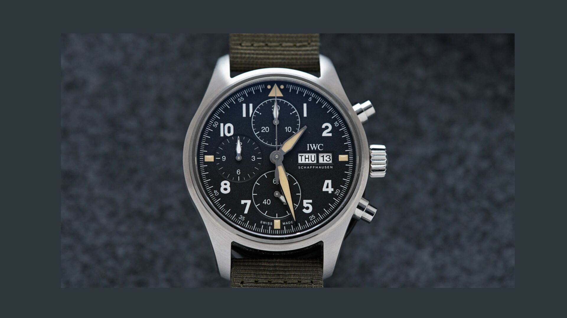IWC Pilot Spitfire Chronograph 41MM IW387901 wristwatch featured under white lighting.