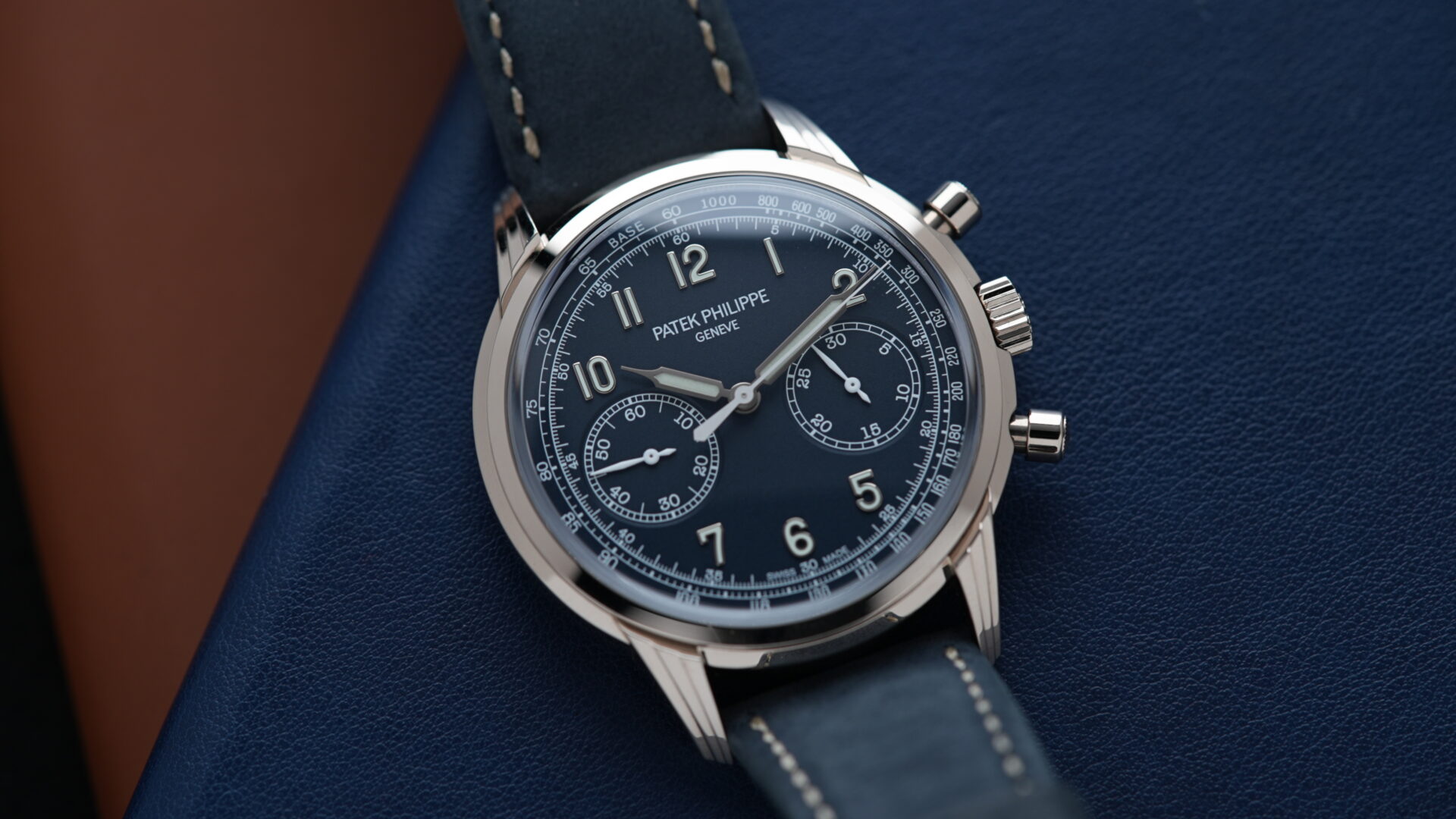 Patek Philippe Chronograph 5172 Complications Chronograph Recently Serviced Seal 5172G-001 White Gold watch displayed on blue leather under white lighting.