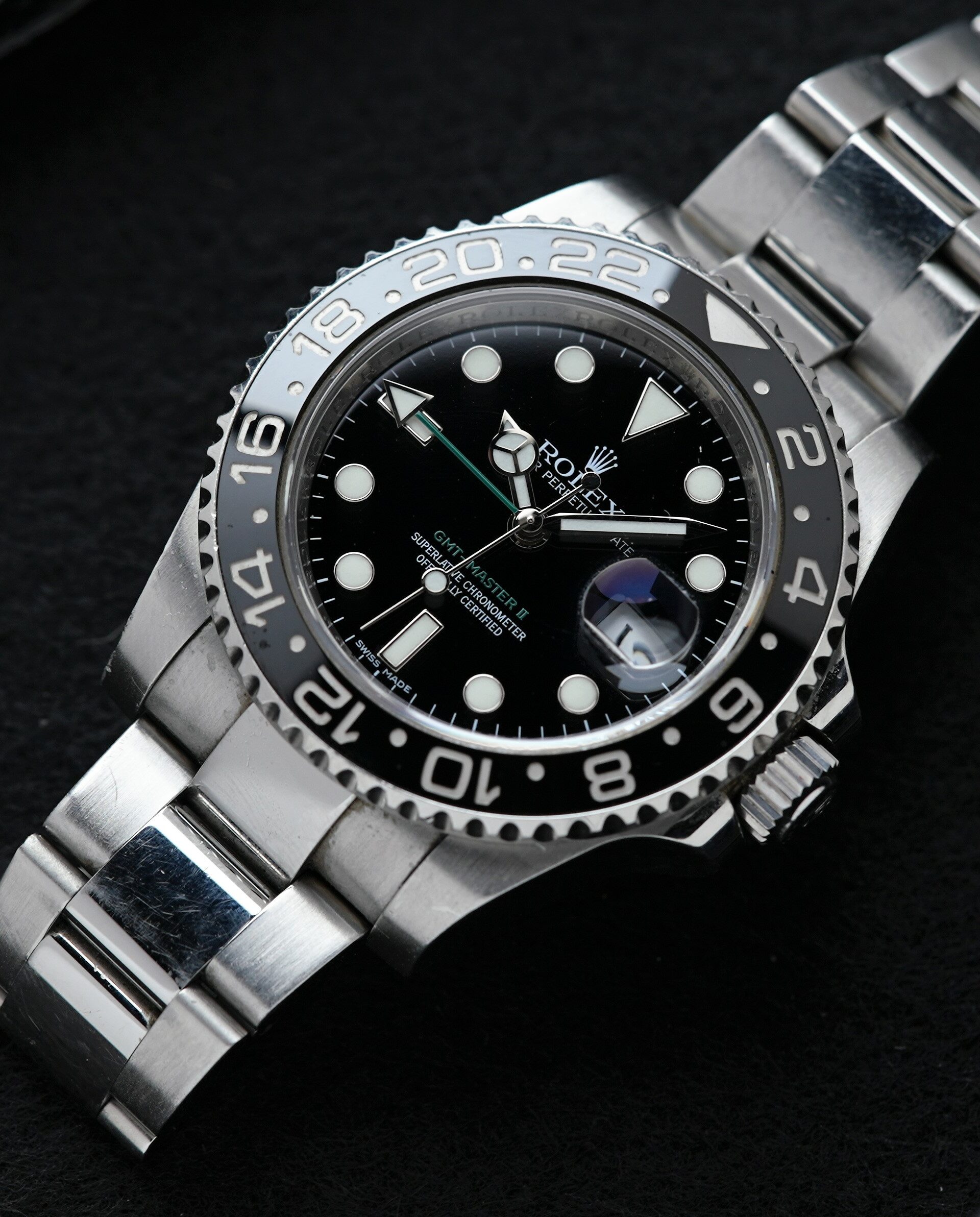 Rolex GMT-Master II Black Discontinued 116710LN wristwatch featured under white lighting on an angle.