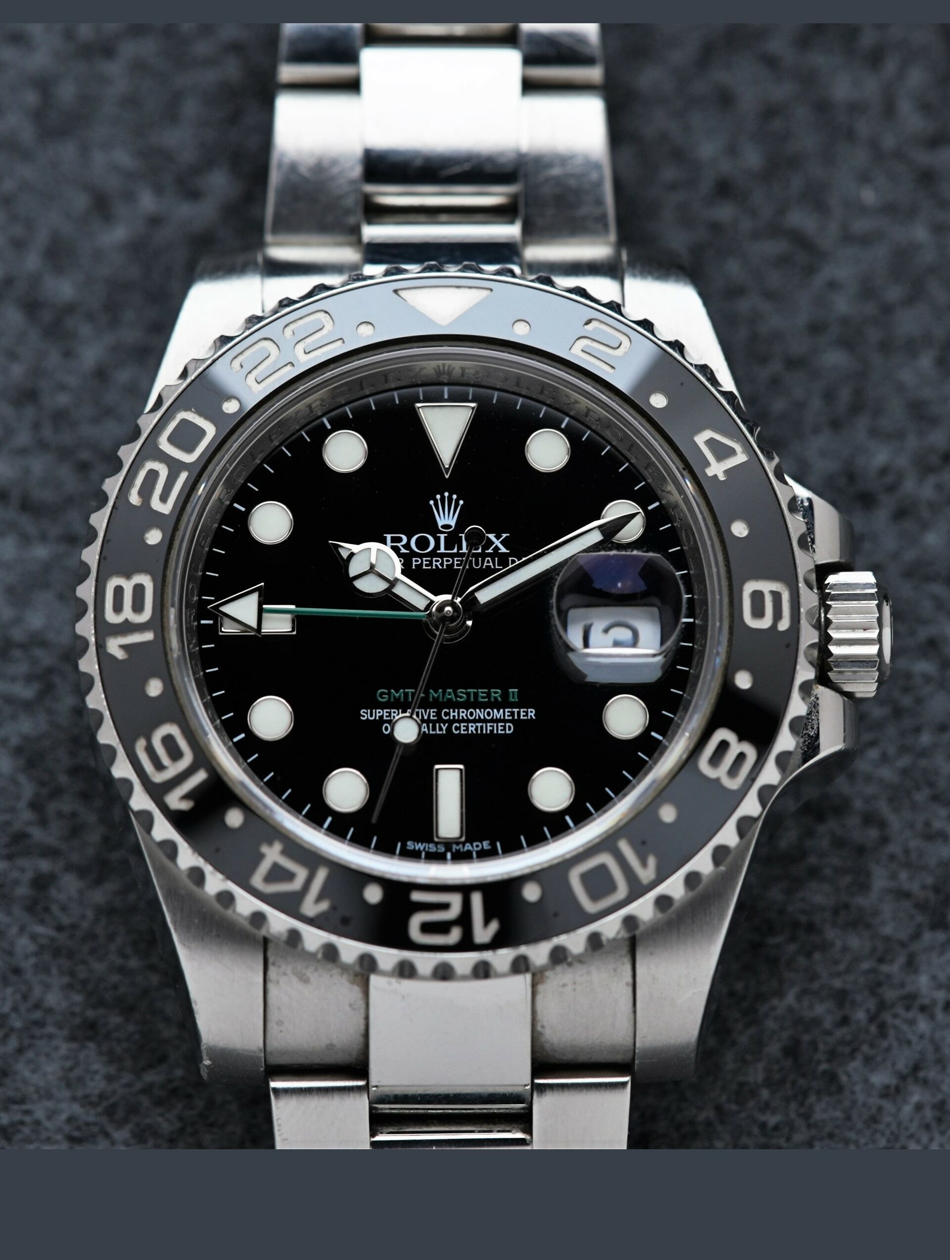 Rolex GMT-Master II Black Discontinued 116710LN wristwatch featured under white lighting.