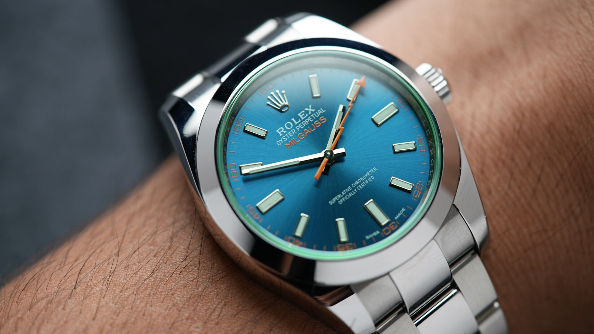 Rolex Milgauss Z Blue UNWORN 116400GV wristwatch displayed on the wrist.