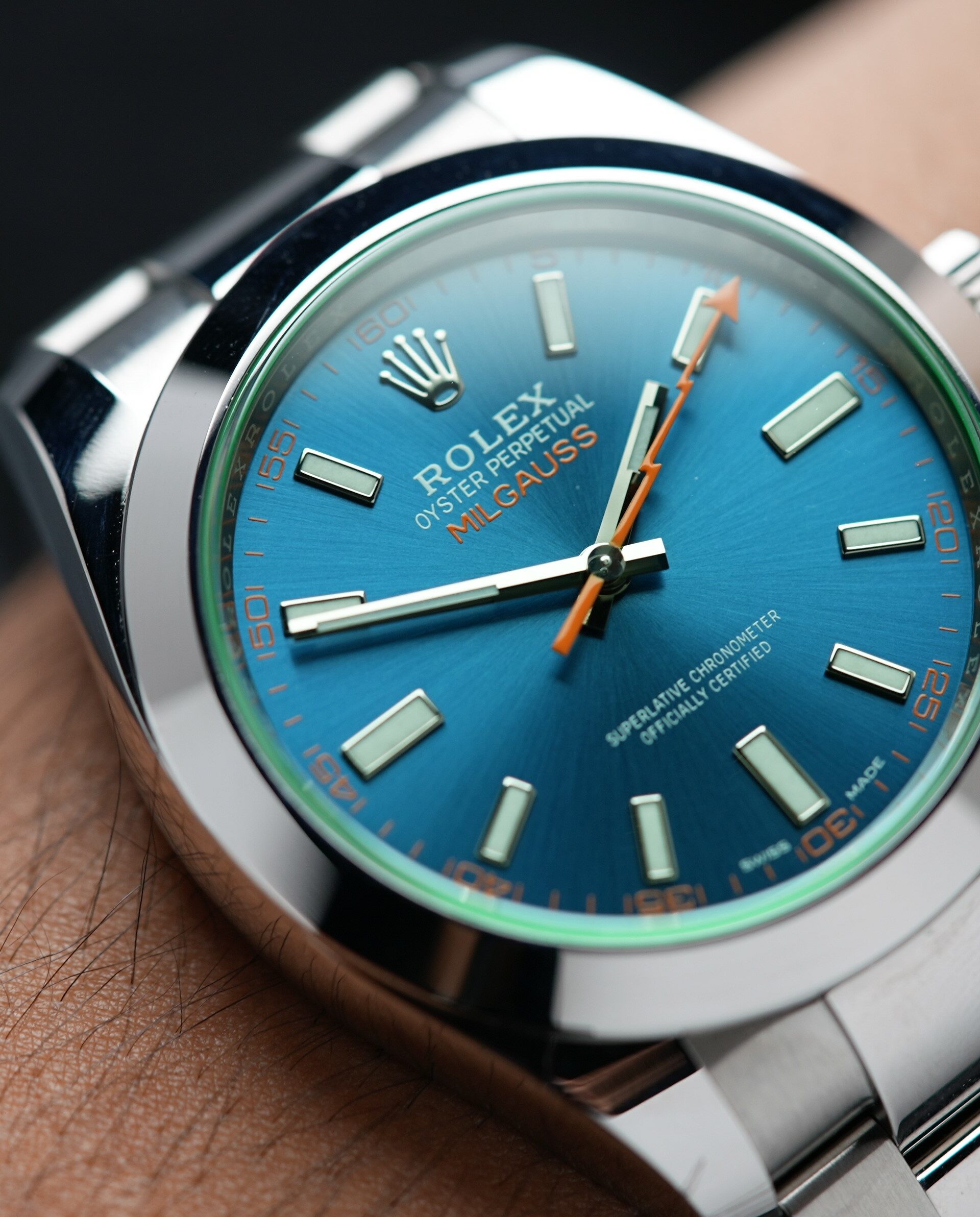Rolex Milgauss Z Blue UNWORN 116400GV wristwatch displayed on the wrist.